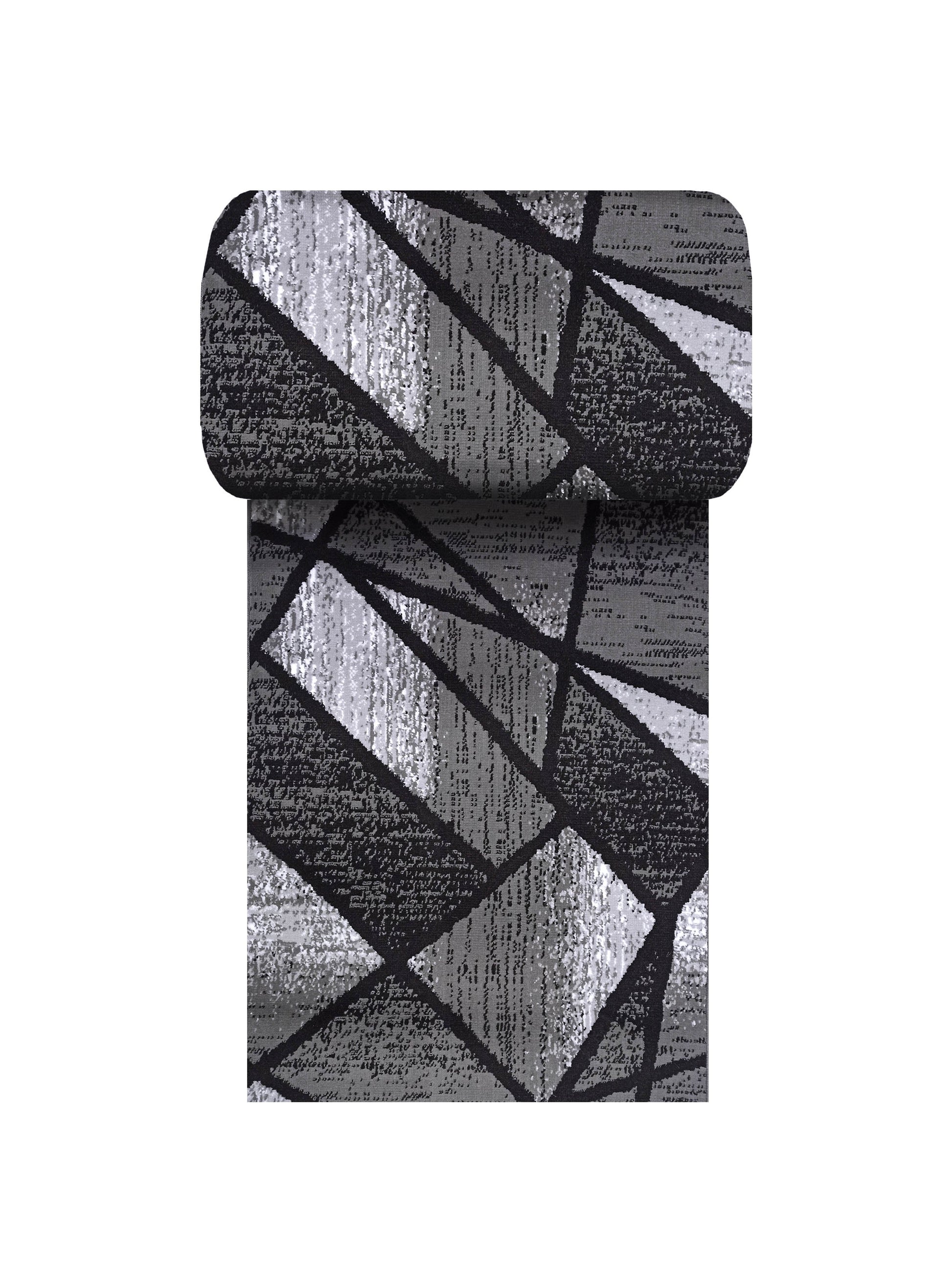 Tapis roulé gris, noir et argenté avec un motif géométrique abstrait de lignes sombres et de textures variées