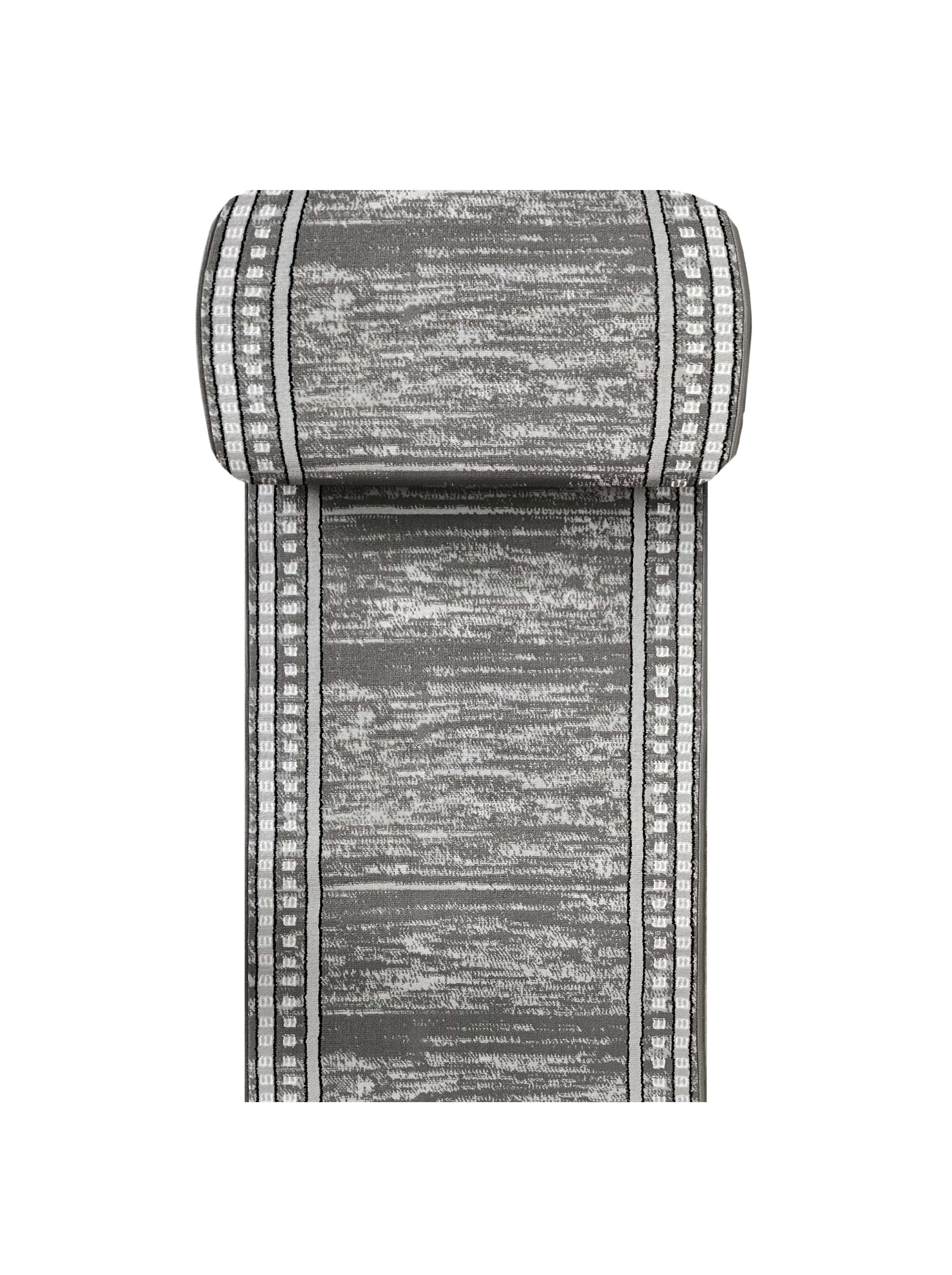 Tapis enroulé gris et blanc avec un motif texturé abstrait et des bandes latérales décoratives