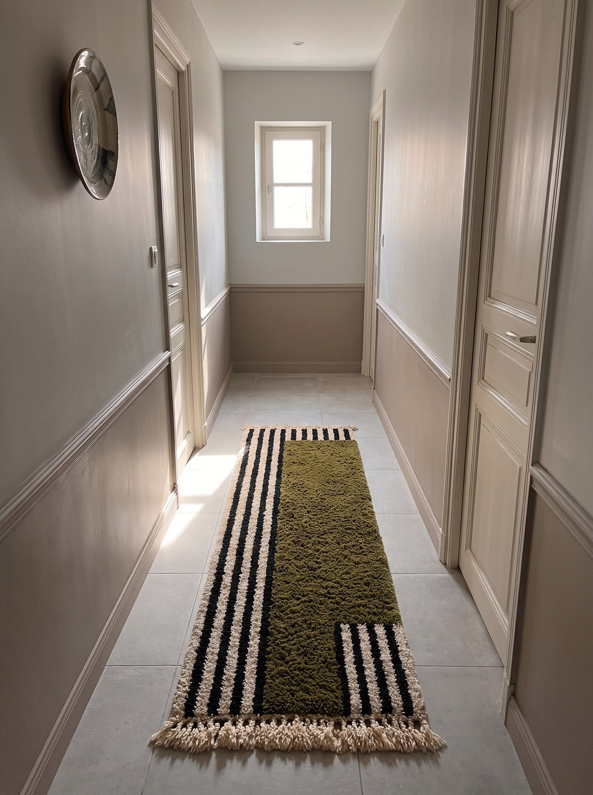 Tanuwar Berber runner with olive green stripes in a hallway, hand-knotted in Morocco
