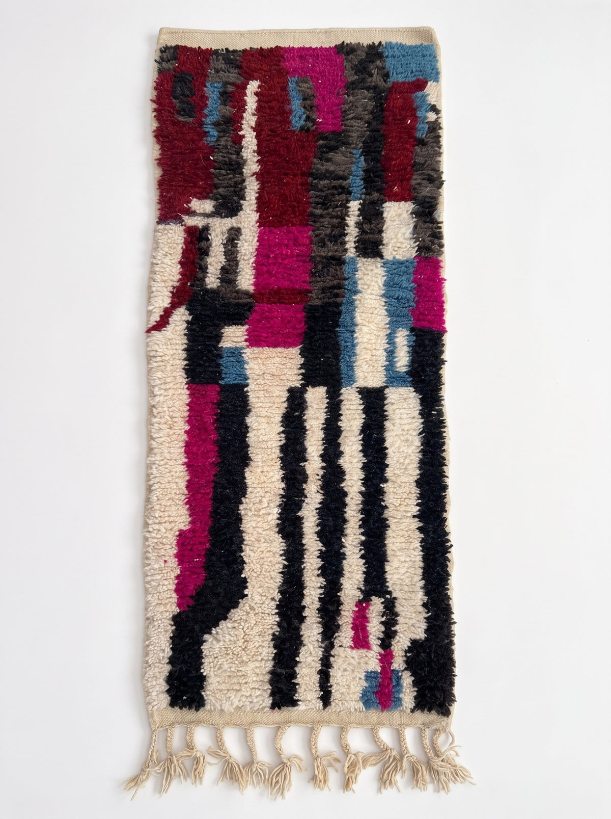 Legzira colourful Berber runner in burgundy and white, laid flat, runner shape, upper half in vertical burgundy blocks