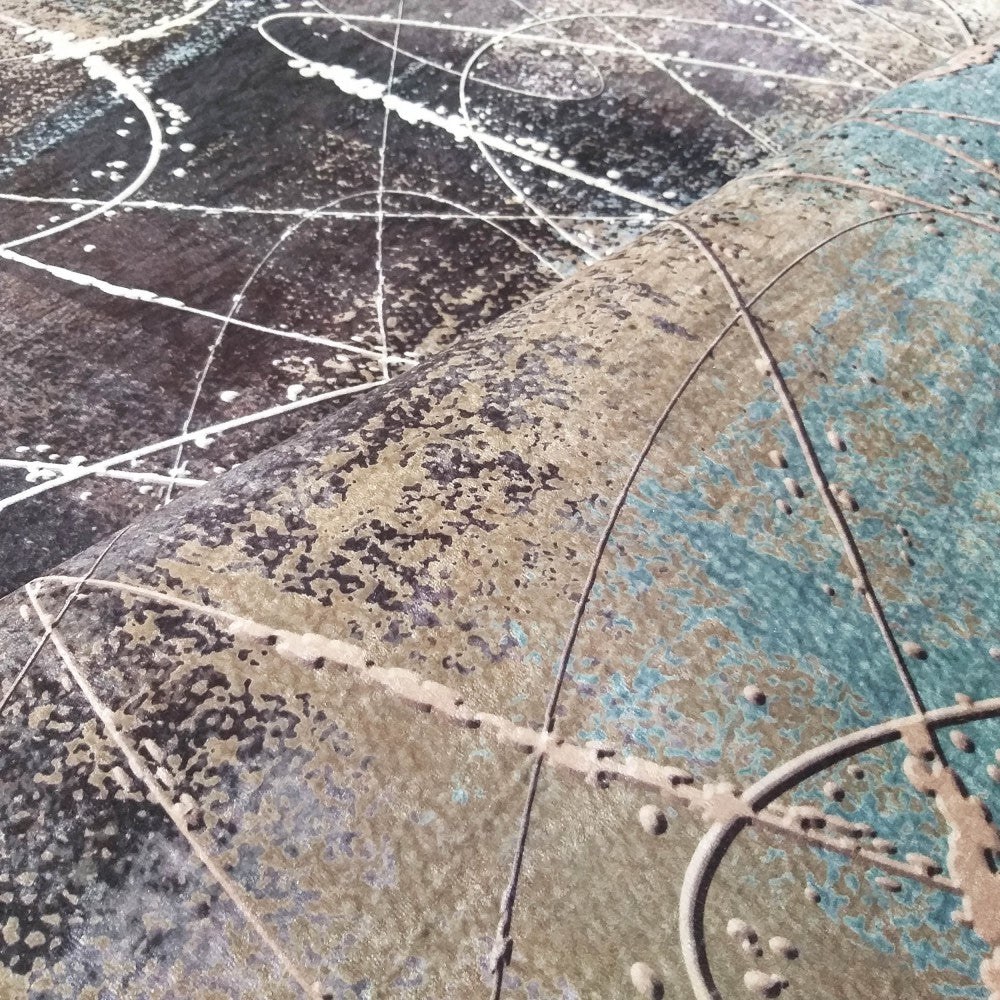 Tapis doux aux motifs abstraits marron foncé, beige clair, turquoise et blanc, évoquant un ciel étoilé