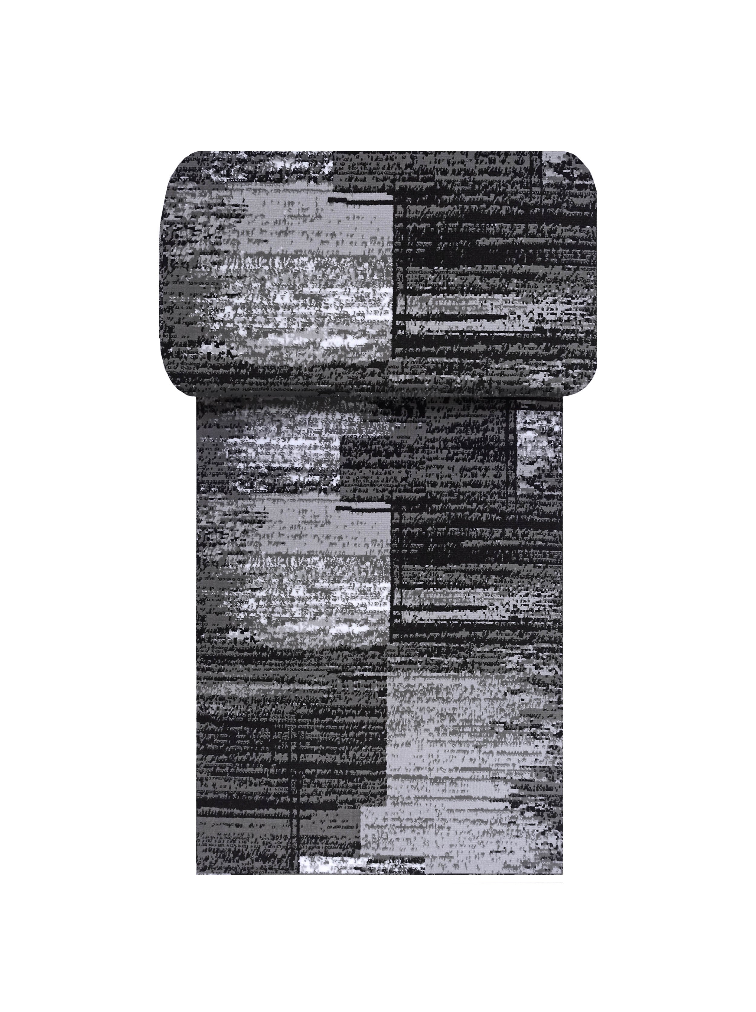 Tapis aux motifs abstraits noirs, gris foncés, gris clairs et blancs, avec une texture rappelant la fourrure courte