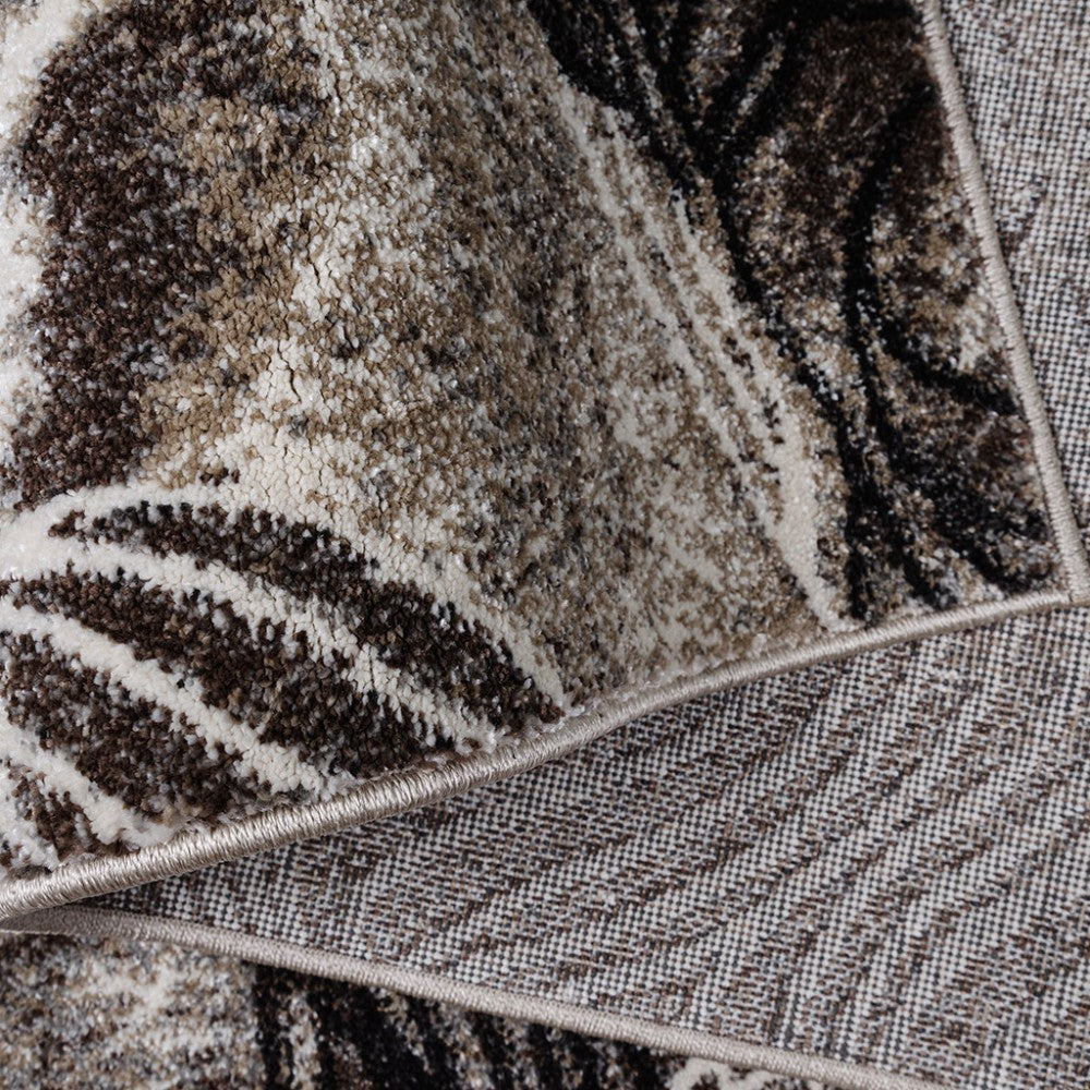 Tapis à poils courts aux motifs abstraits marron, beiges, blancs et noirs, avec le revers tissé visible