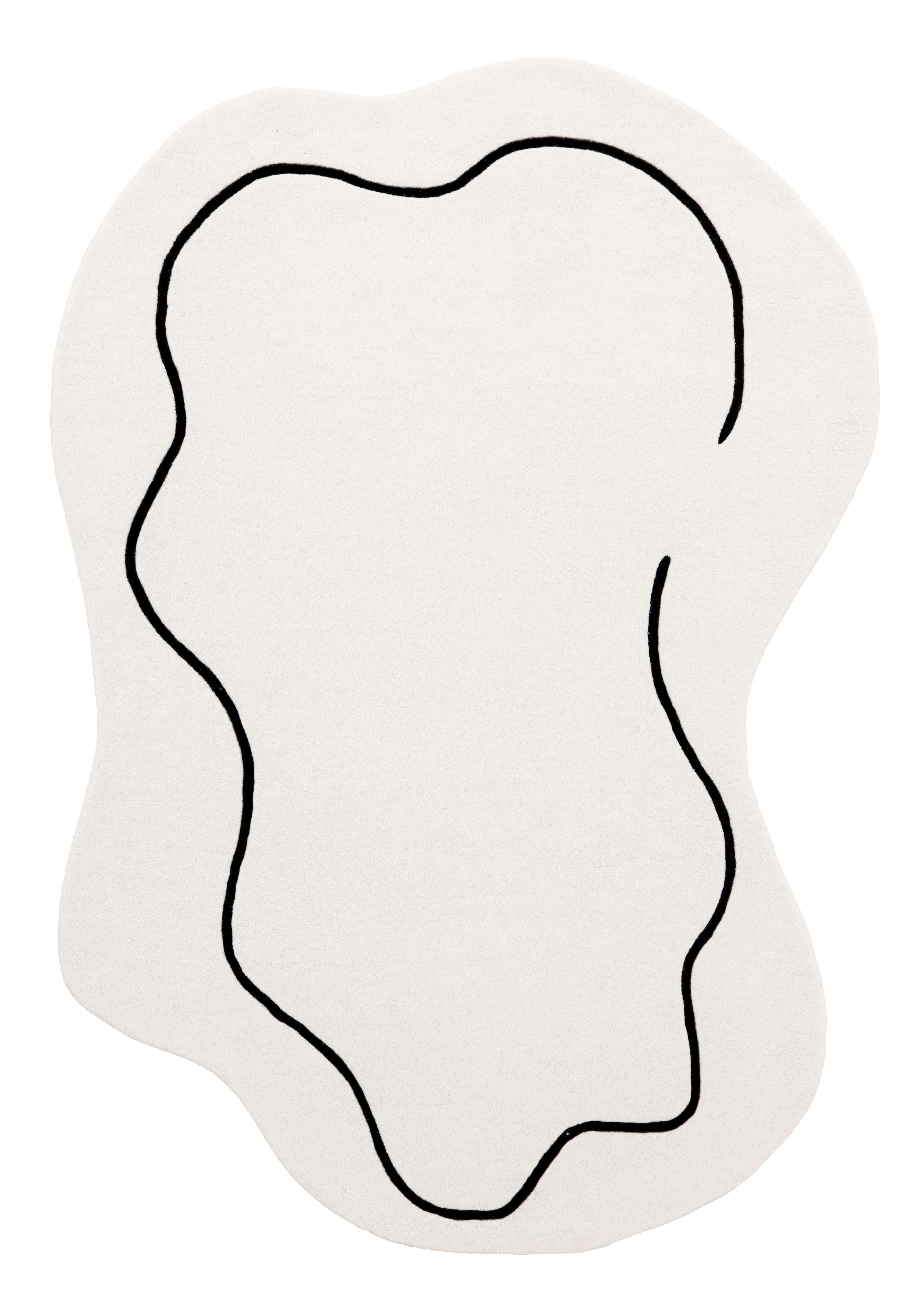 Tapis de type abstrait, motif noir sur fond ivoire. Forme ovale. Pièce