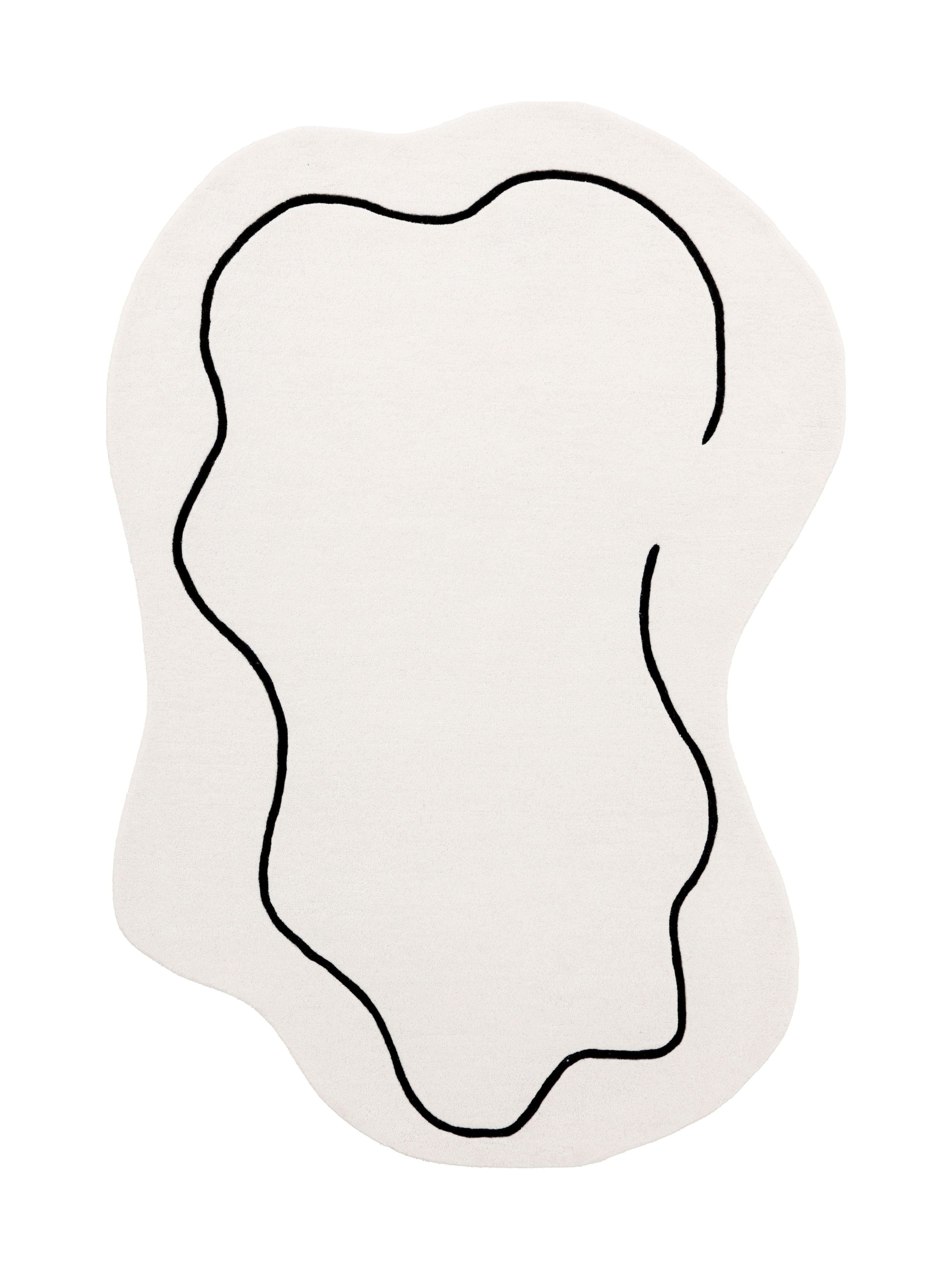 Tapis de type abstrait, motif noir sur fond ivoire. Forme ovale. Pièce