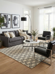 Tapis rectangulaire au design épuré en noir et ivoire. Style contemporain pour ce salon