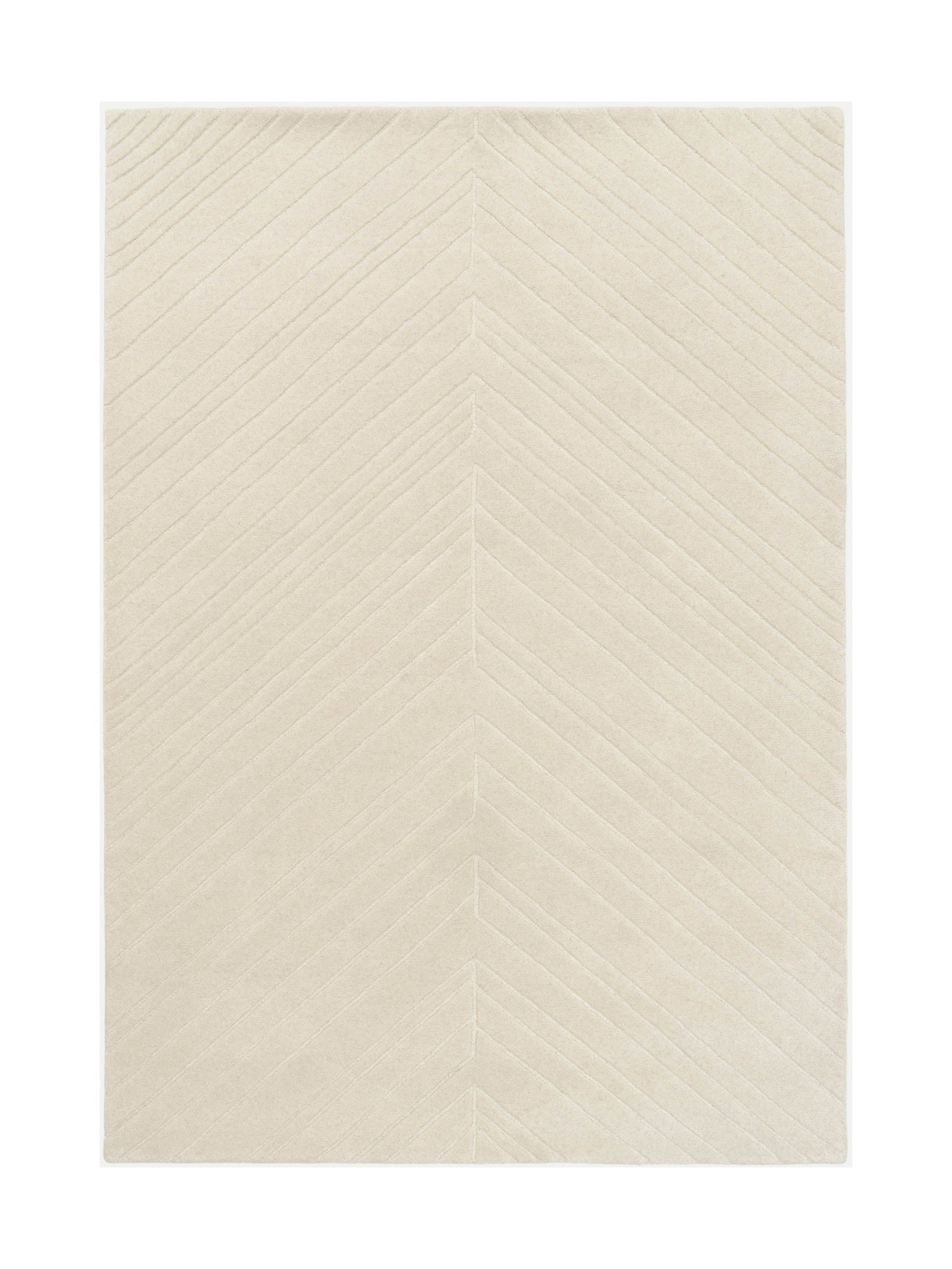 Tapis rectangulaire beige clair avec motif chevron en relief, style moderne et ambiance épurée