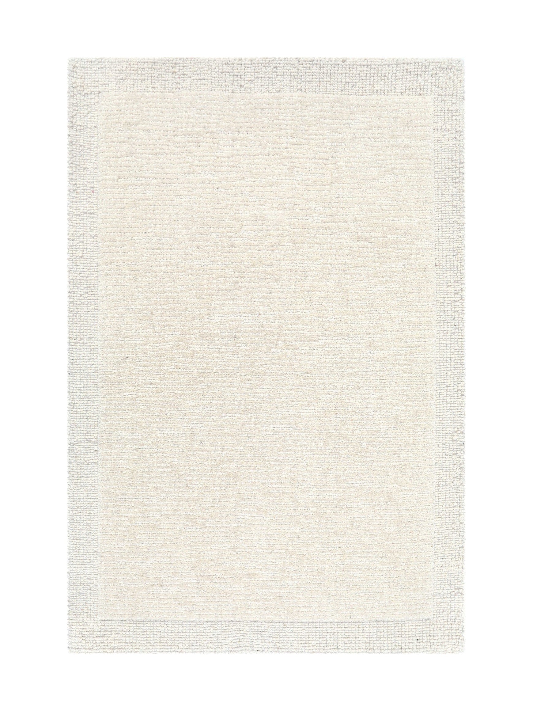 Tapis rectangulaire à motif texturé, tons crème et beige, ambiance neutre et chaleureuse
