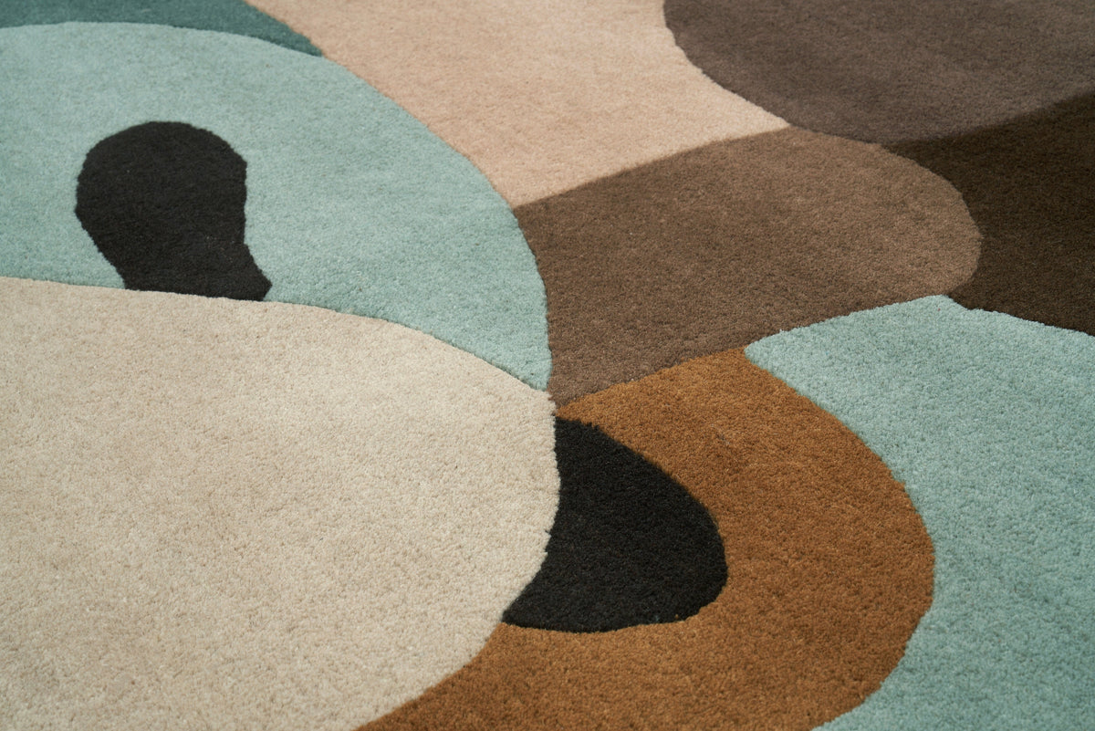 Détail texture du tapis Venus Pastelle fait main en laine. Zoom sur les fibres et le tissage, forme rectangulaire.