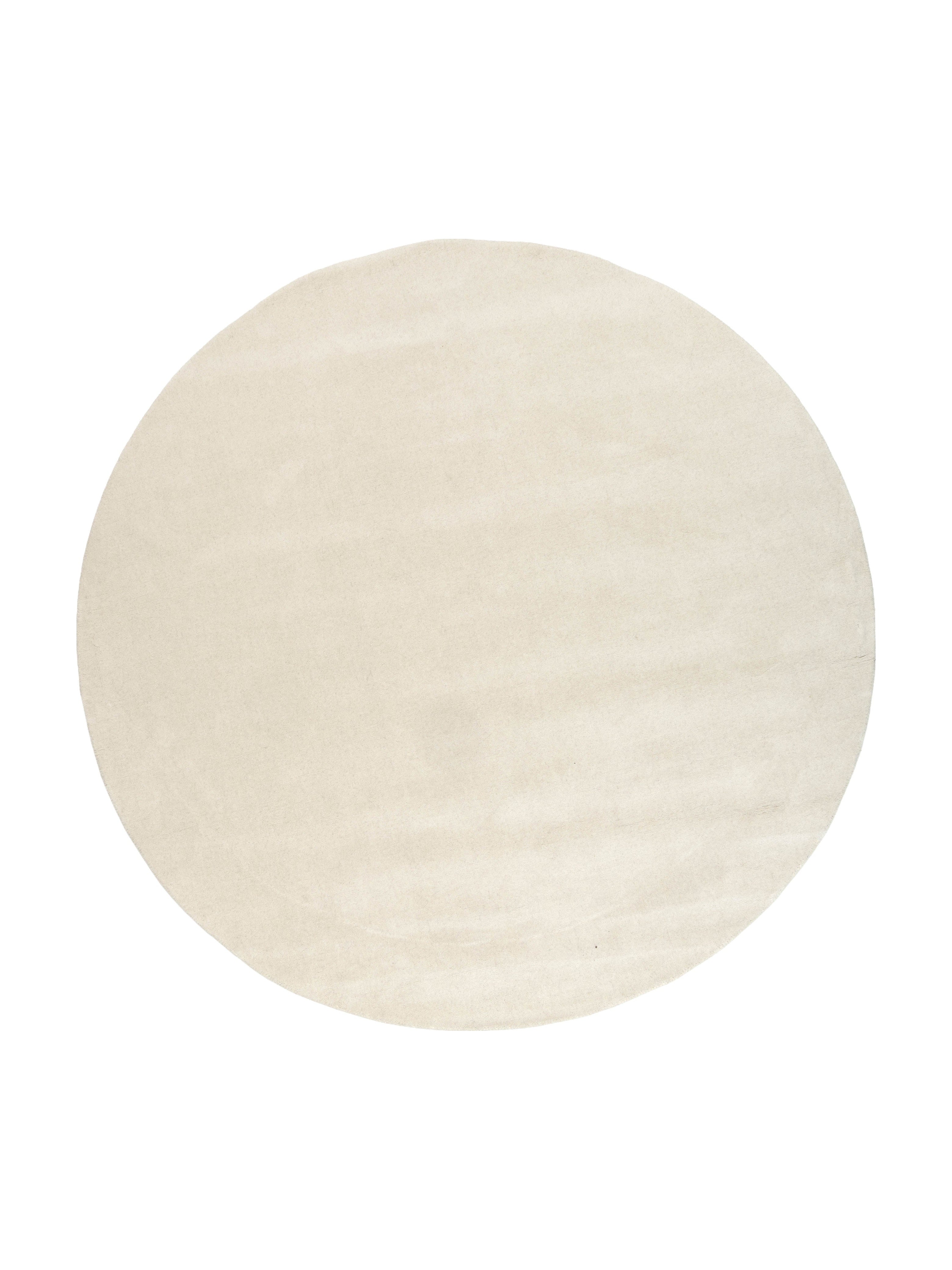 Type tapis rond, couleur ivoire, pièce. Style uni, motif subtil