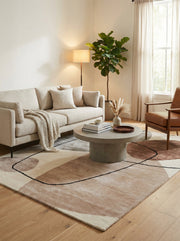 Tapis de type moderne, design épuré, harmonie dans la pièce. Formes ovales et rondes, couleurs beige et terracotta