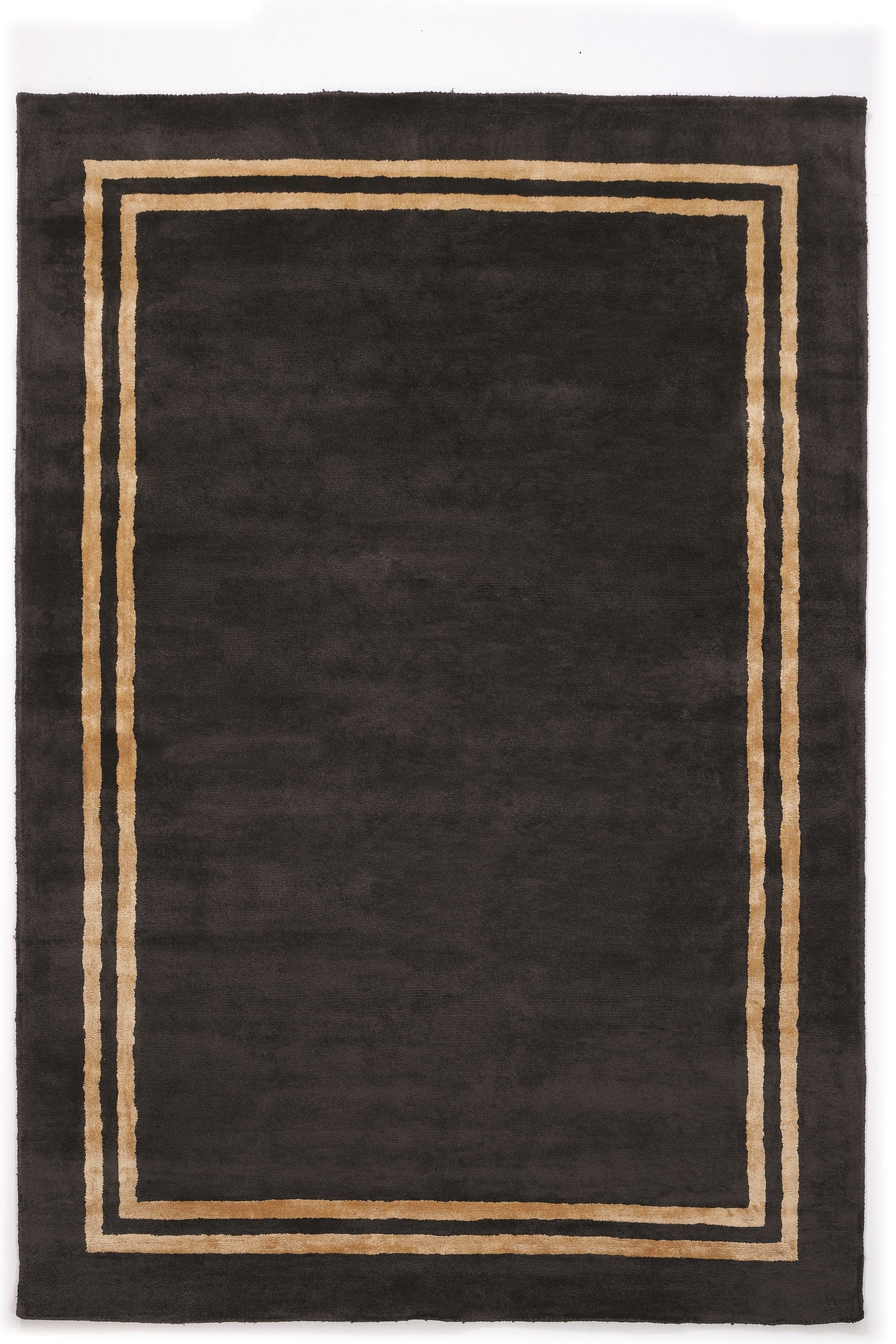 Tapis rectangulaire, style moderne, noir avec bordure dorée, ambiance sobre et élégante