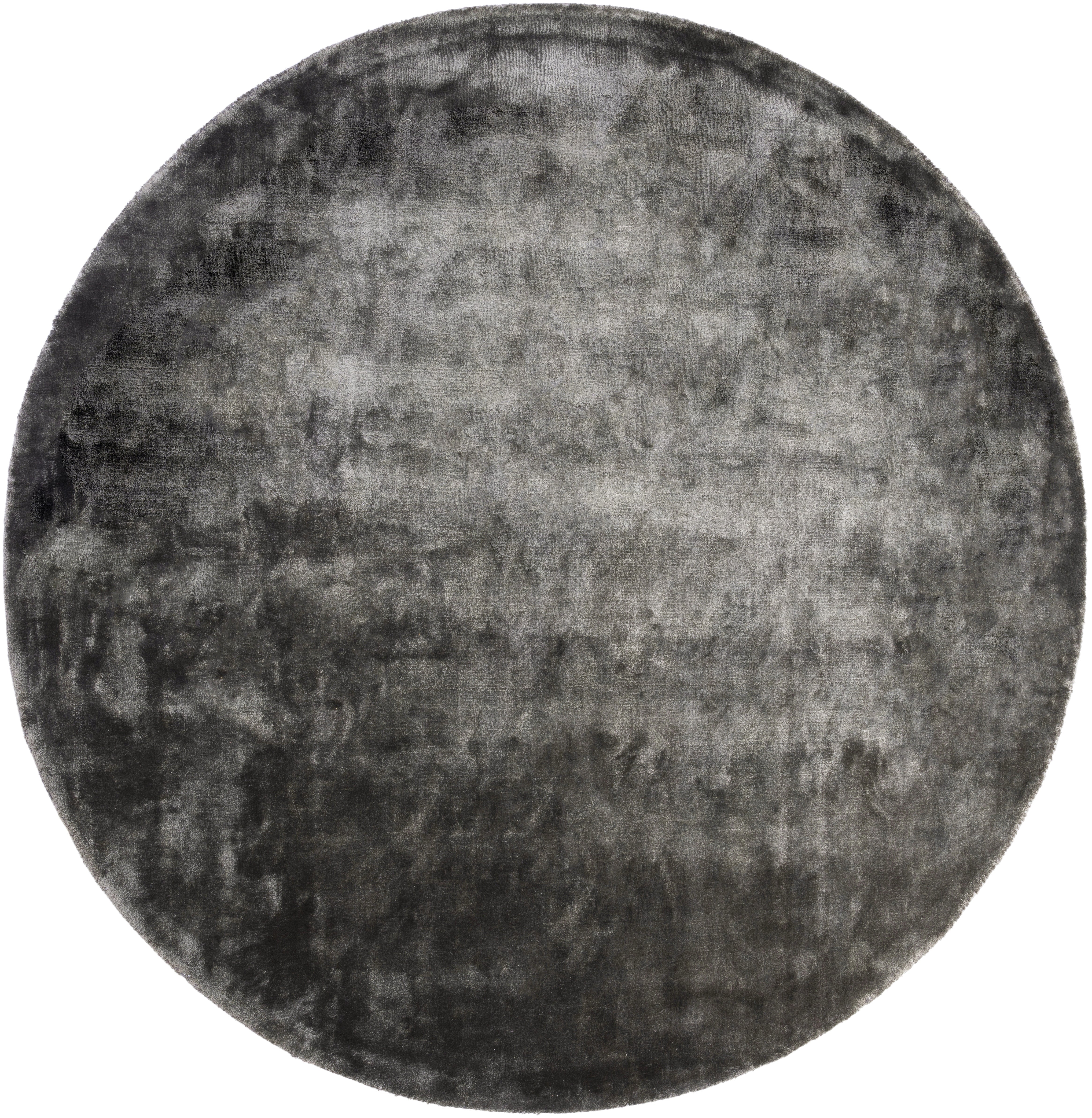 Type tapis rond, style contemporain, pièce. Couleur gris foncé, aspect velours