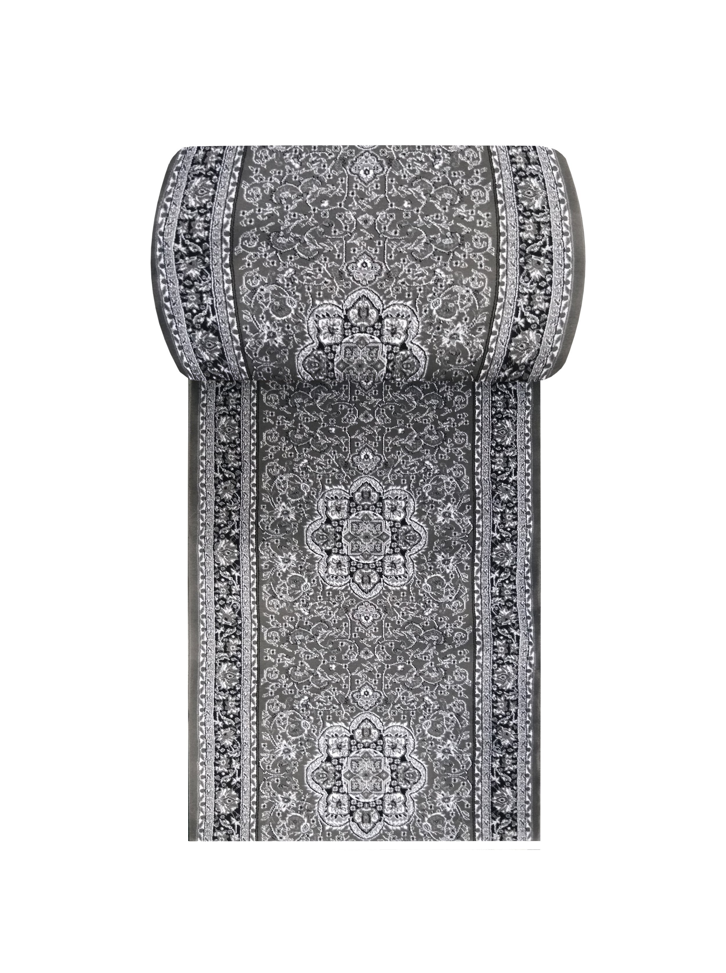 Tapis enroulé sur sa partie supérieure, aux motifs ornementaux traditionnels gris, noirs et blancs