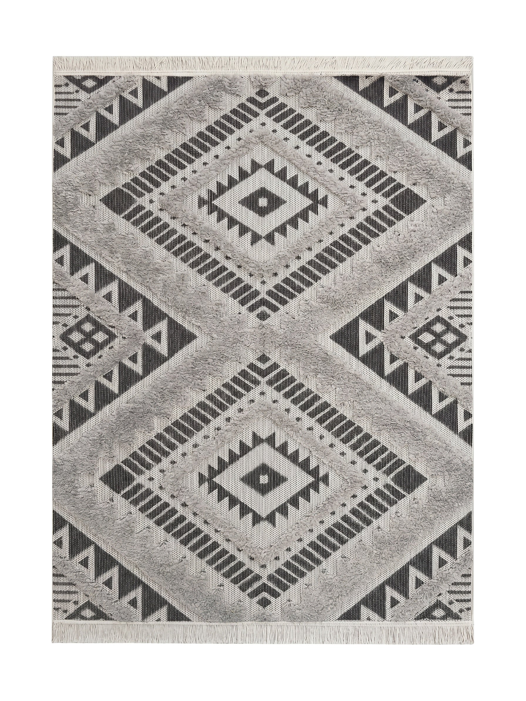 Tapis blanc, noir et gris à motifs géométriques ethniques avec des zones touffues et des franges aux extrémités