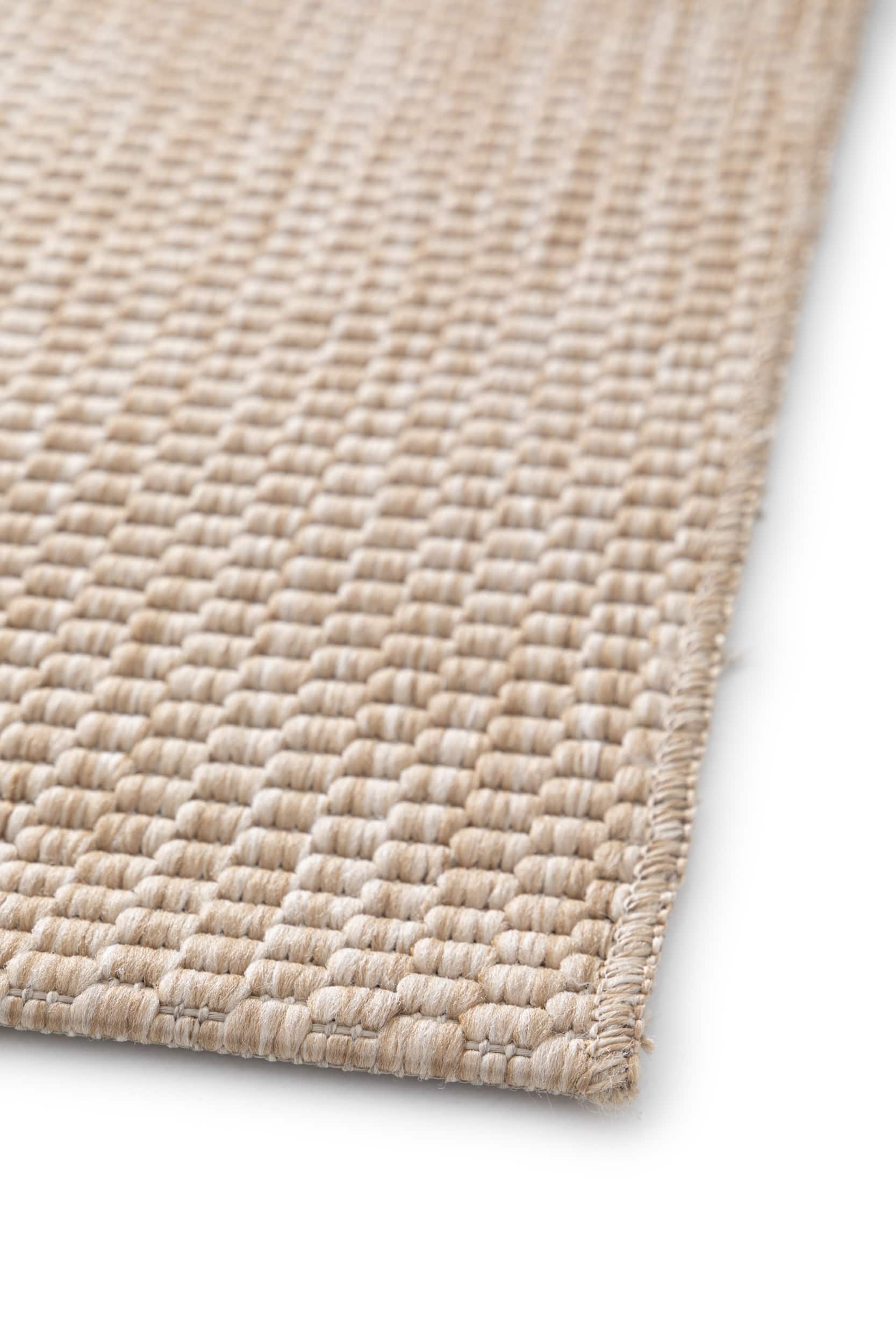 Bordure de tapis tissée, finitions de qualité. Couleurs beige et ambre