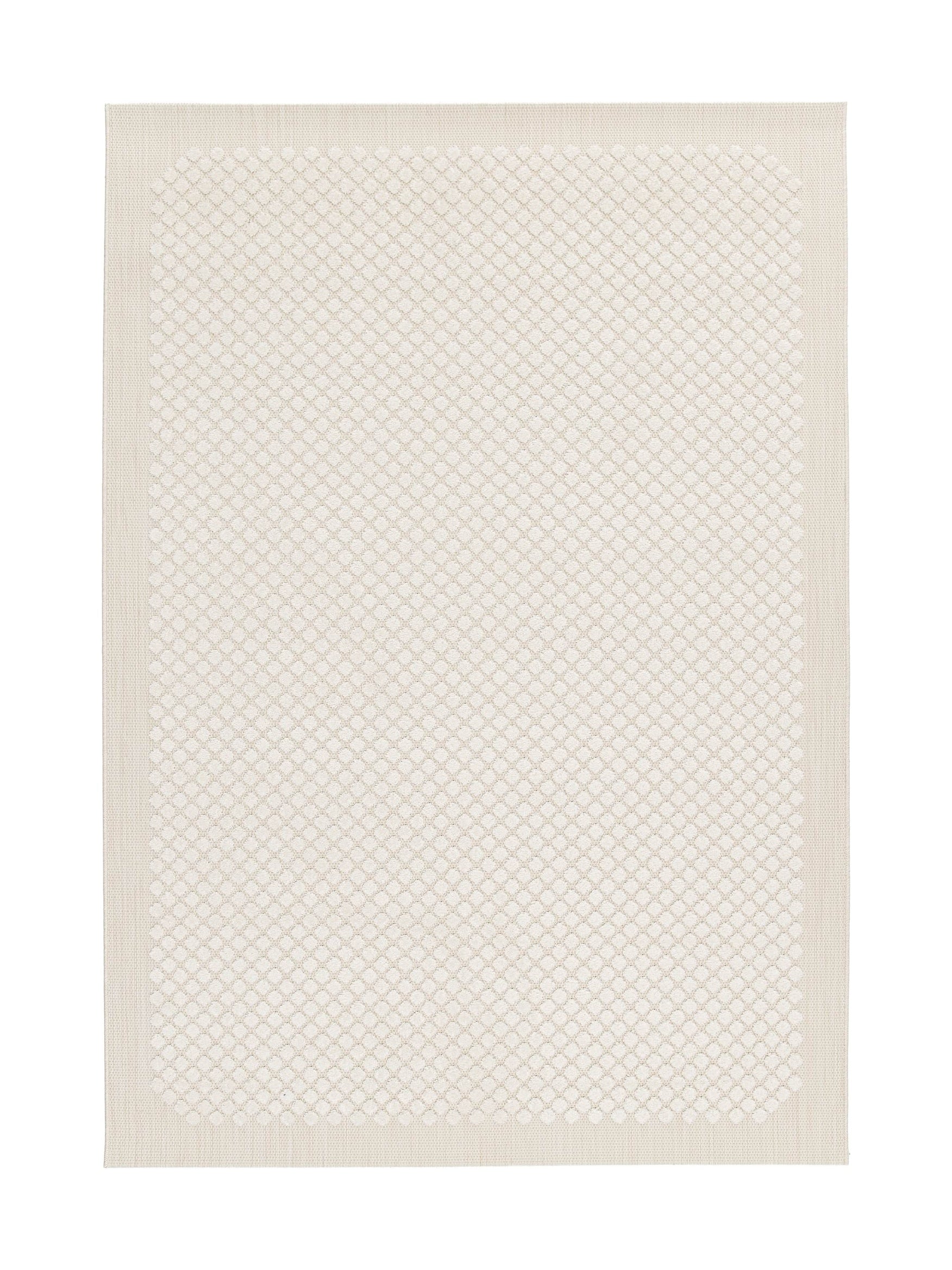 Tapis rectangulaire beige clair avec un motif en relief de losanges et de cercles imbriqués