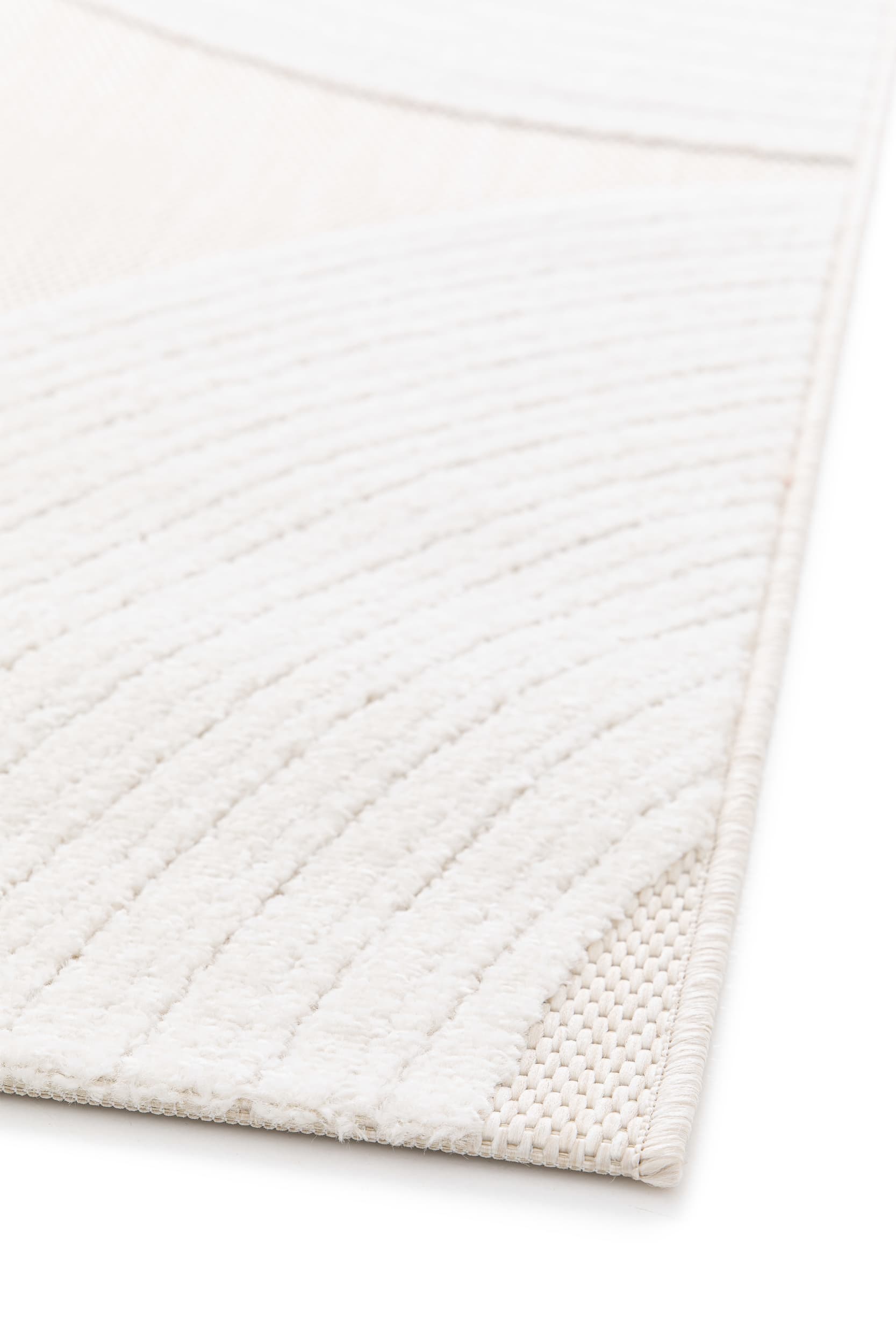 Bordure de tapis beige clair. Finition tissée avec des fils crème. Tapis rectangulaire