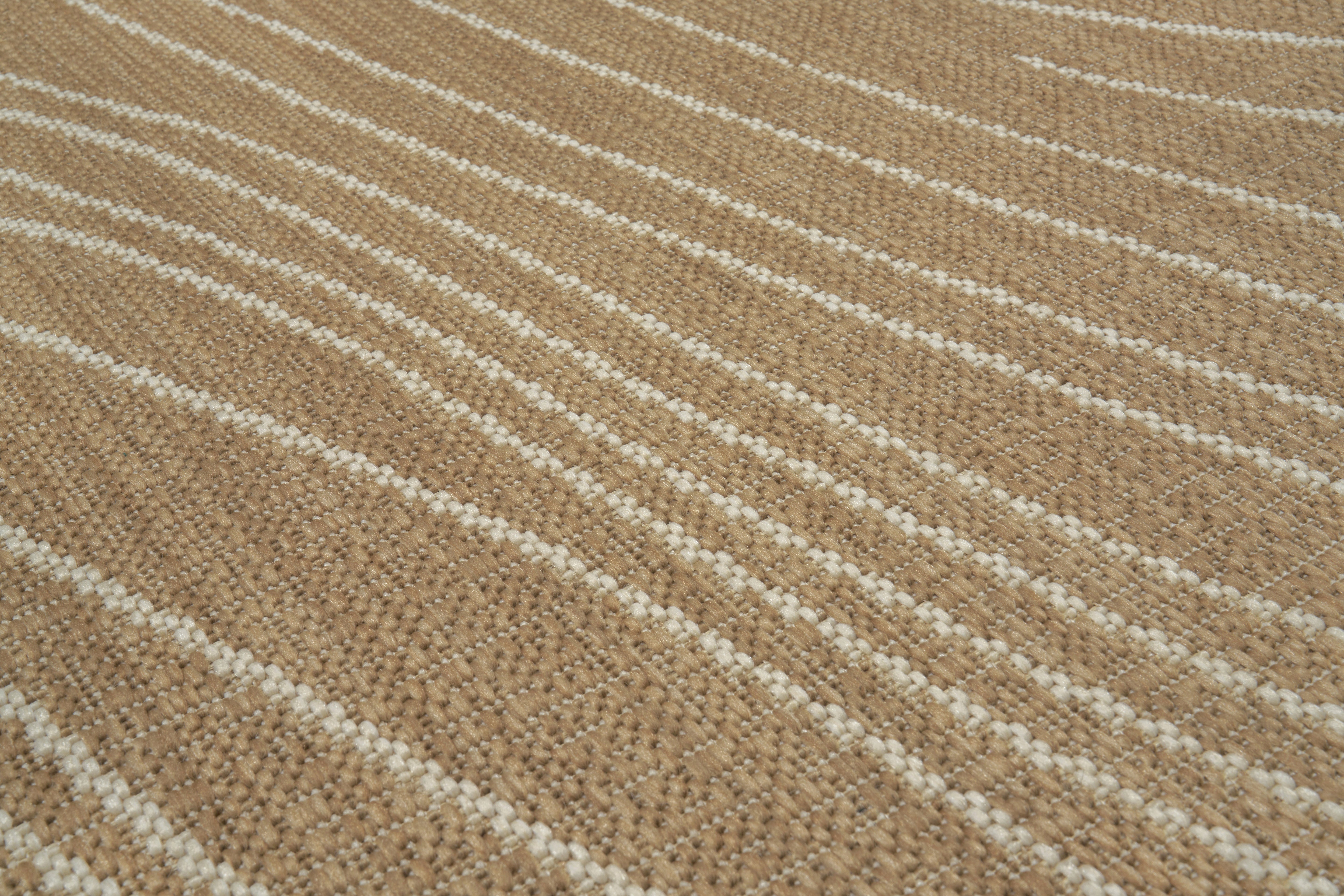Tapis tissé à rayures diagonales beige et blanc. Tissage texturé avec relief. Aspect tactile rugueux