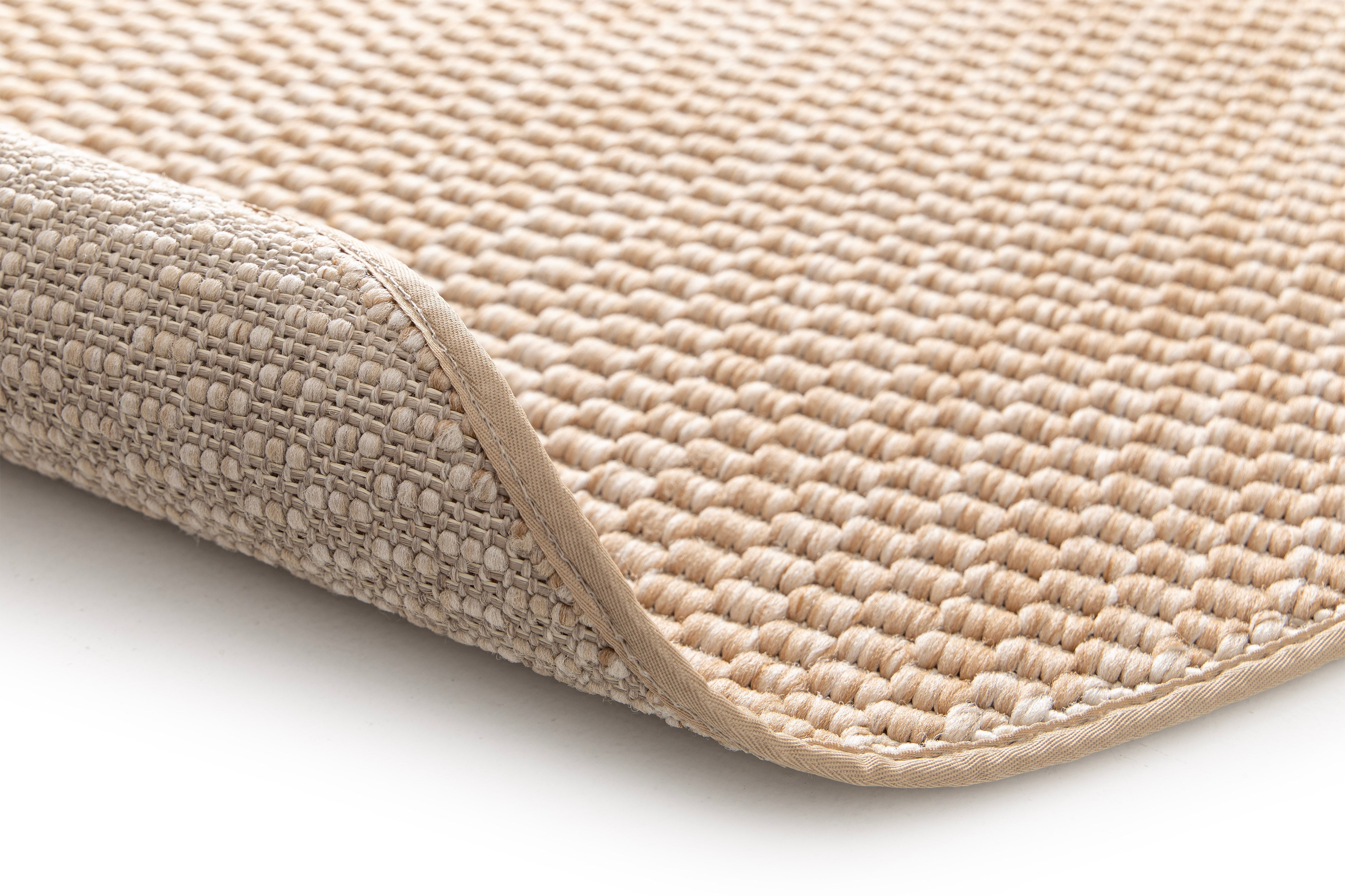 Tapis rond beige et ambre, tissage dense, aspect texturé. Moelleux et confort apparent