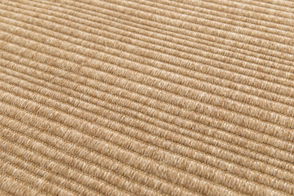 Tissage côtelé d'un tapis d'extérieur terracotta clair, montrant le grain des fibres et le relief