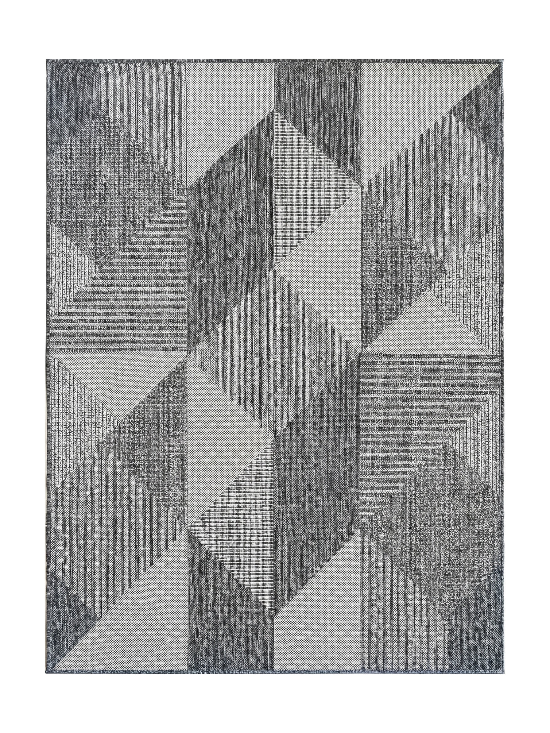 Tapis géométrique gris clair et gris foncé avec des motifs de triangles et de formes texturées en relief optique