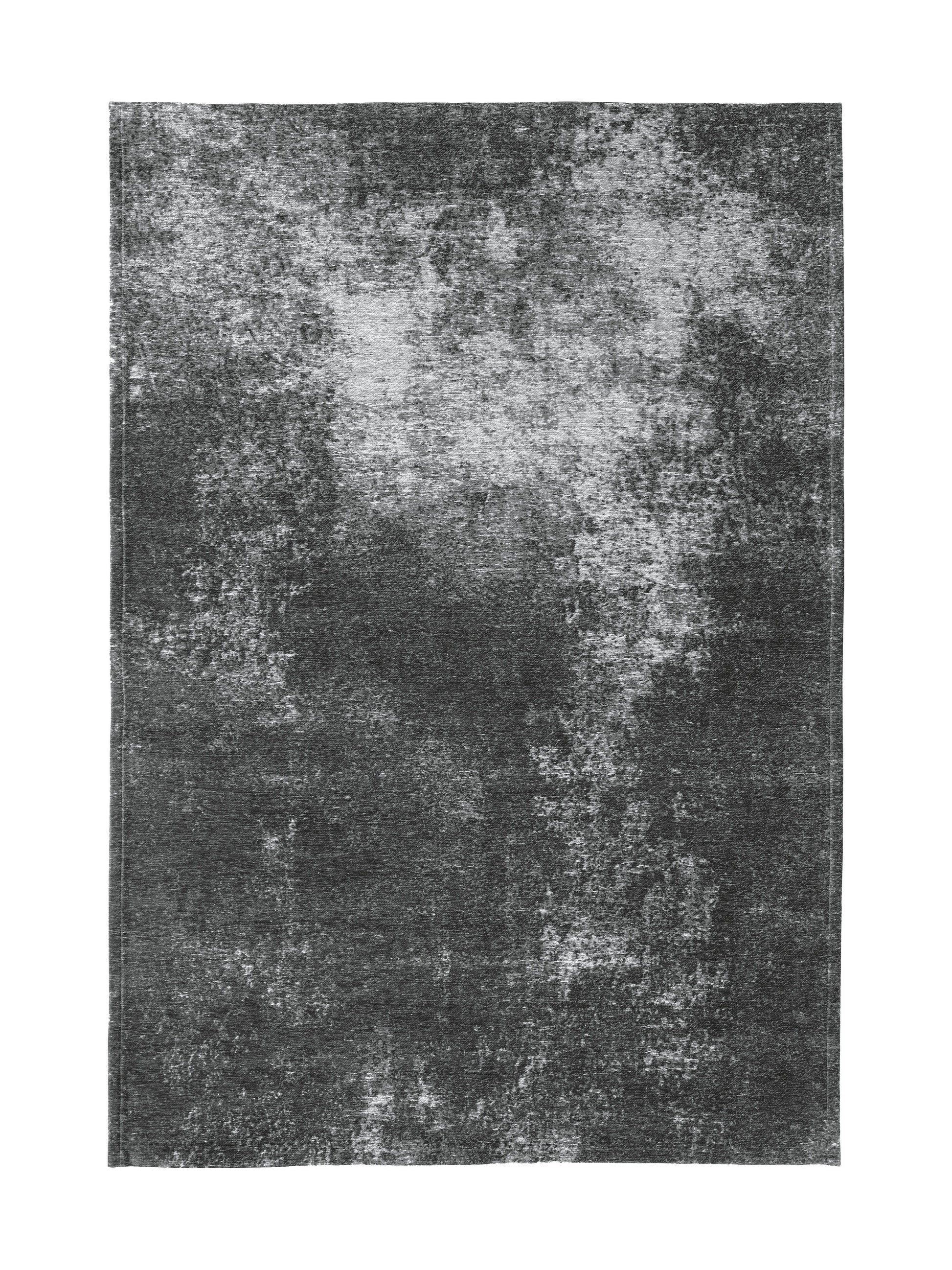 Tapis rectangulaire gris foncé avec un motif texturé et des nuances claires, ambiance sobre