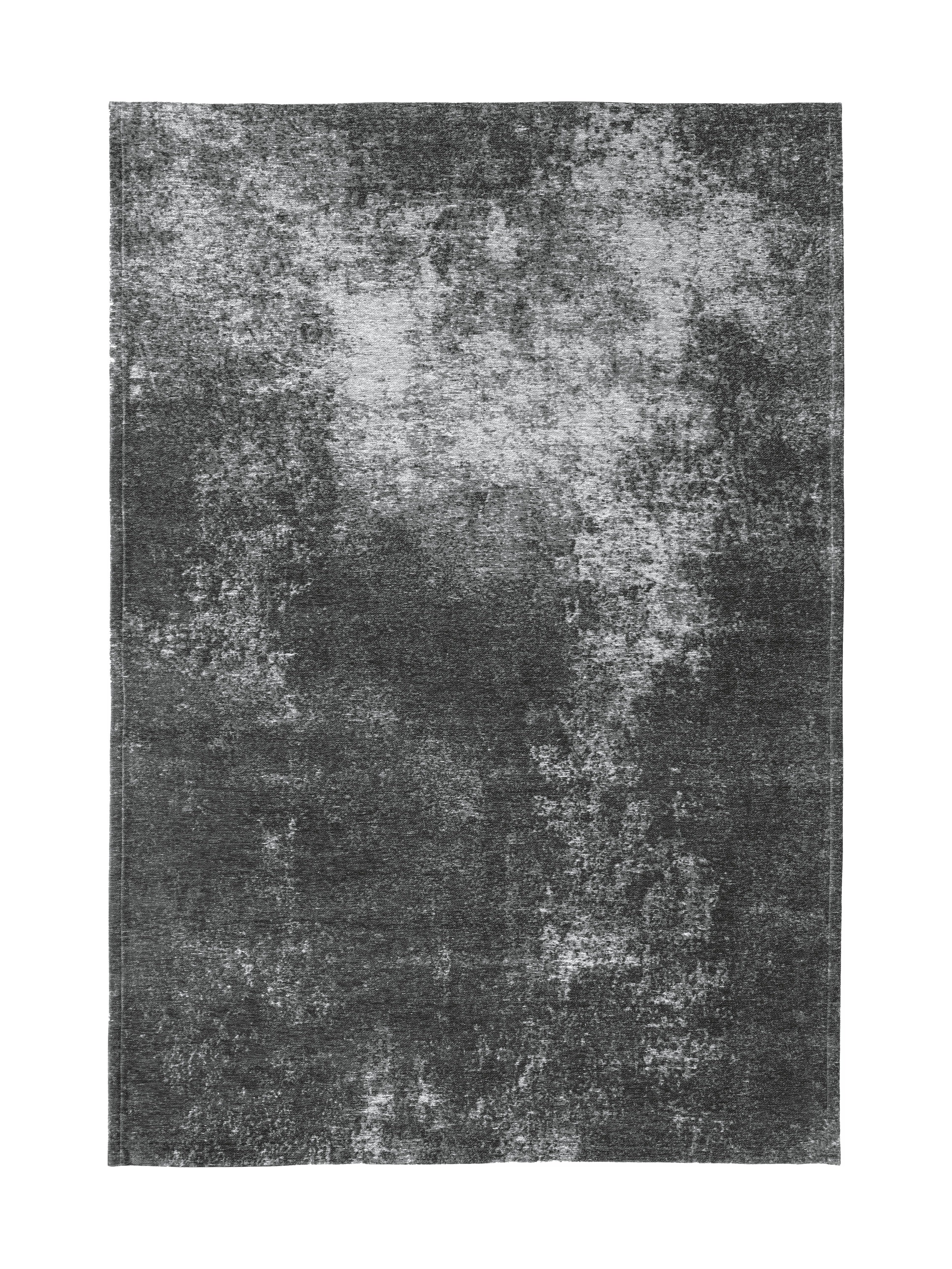 Tapis rectangulaire gris foncé avec un motif texturé et des nuances claires, ambiance sobre