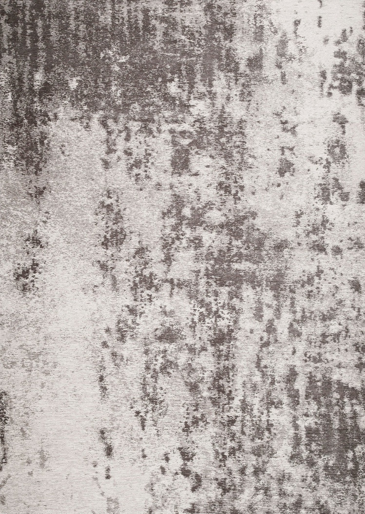 Tapis rectangulaire gris clair et foncé avec un motif abstrait, idéal pour une ambiance moderne