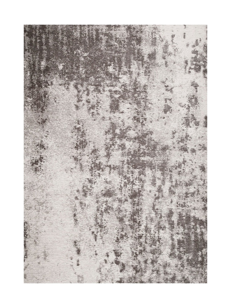 Tapis rectangulaire gris clair et foncé avec un motif abstrait, idéal pour une ambiance moderne