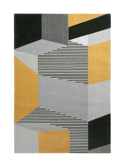 Tapis rectangulaire au motif géométrique abstrait, avec des blocs gris, noirs, jaunes et des rayures blanches et noires