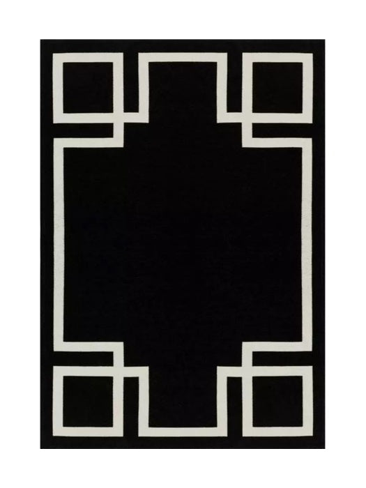 Tapis rectangulaire noir avec motif géométrique blanc. Style moderne et épuré