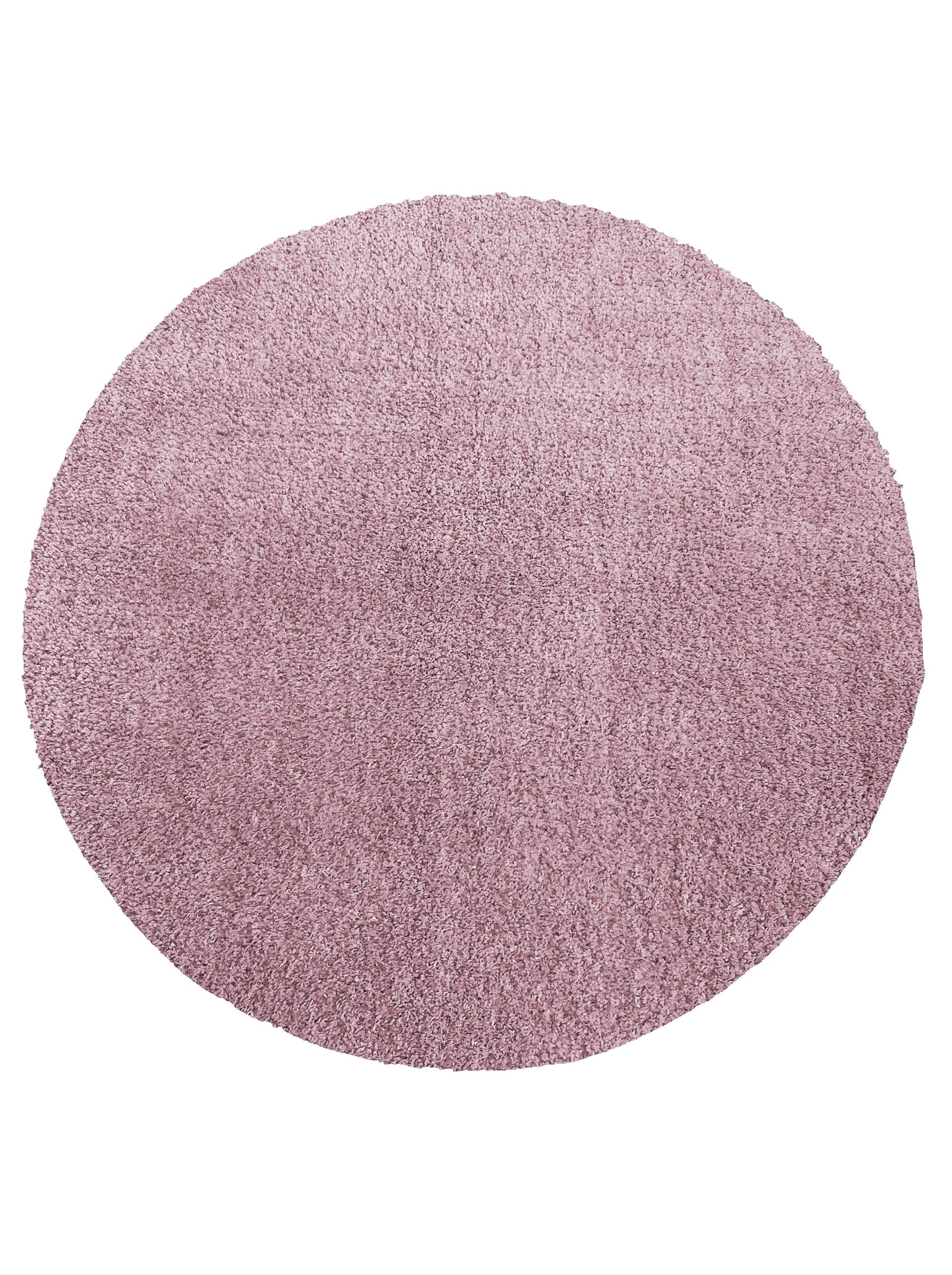 Tapis circulaire à poils longs, de couleur rose violacé, présentant une texture dense et moelleuse