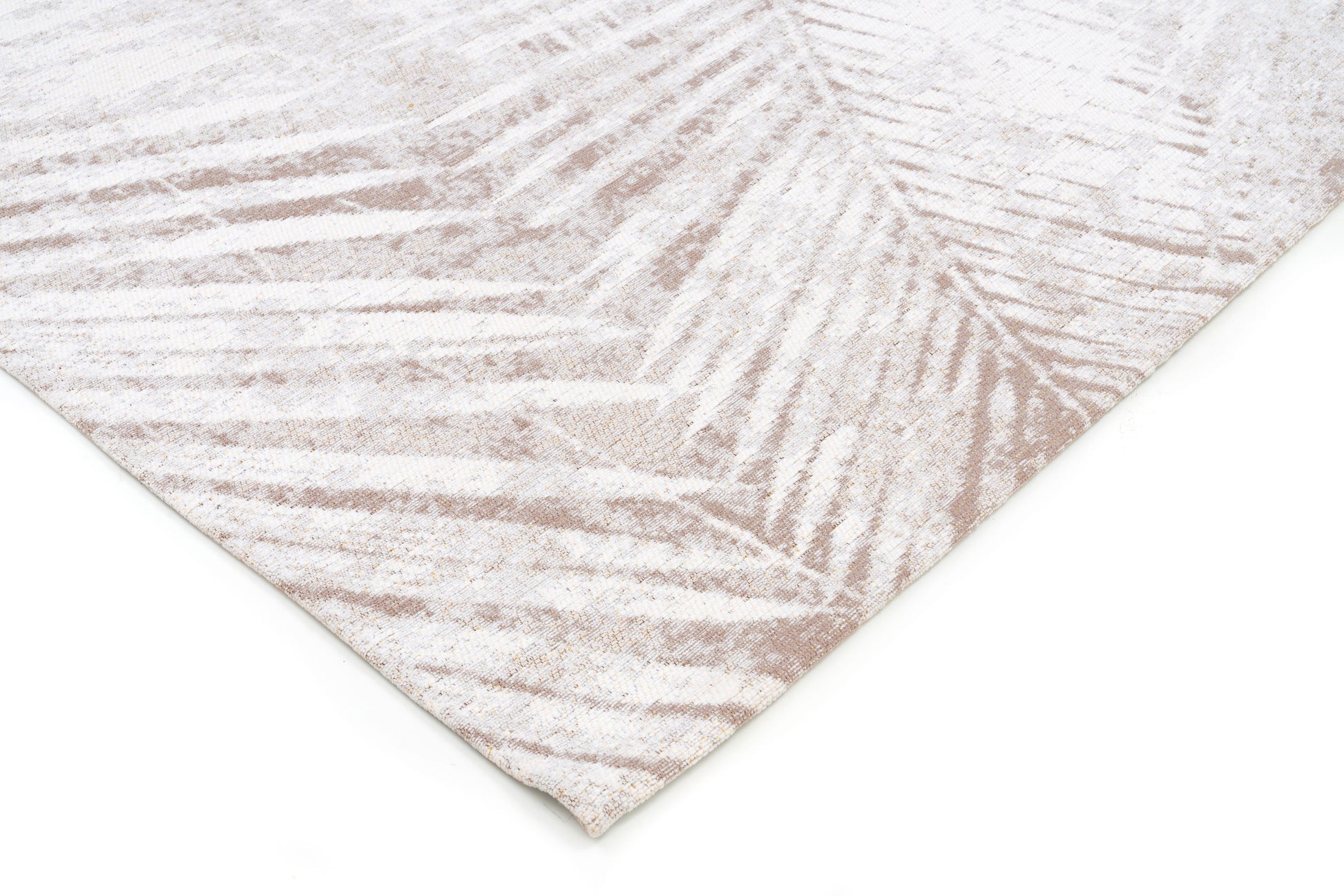 Tapis rectangulaire beige avec motif de feuilles. Finition de qualité, couleurs douces. Ambiance naturelle