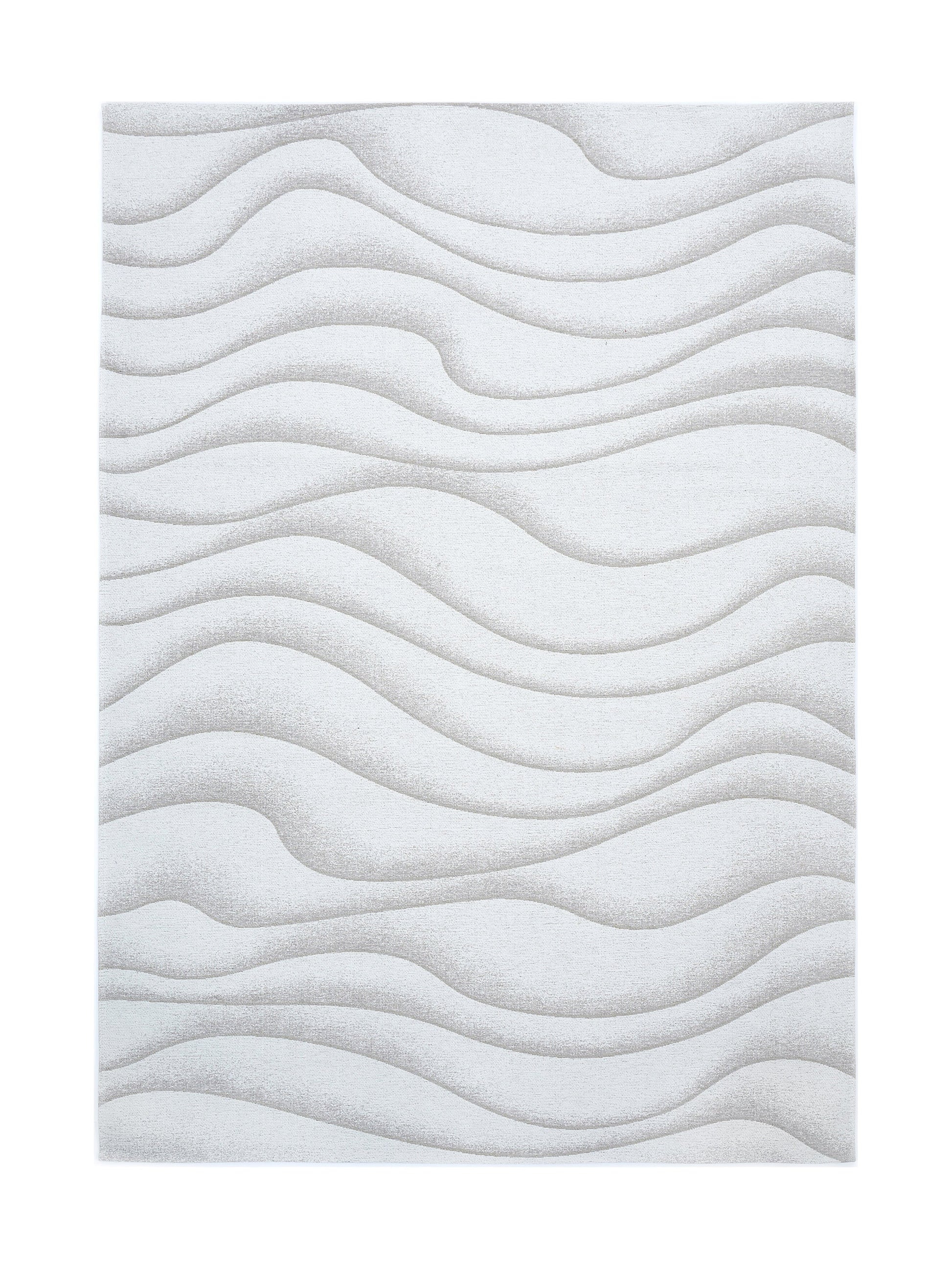 Tapis rectangulaire beige clair avec un motif ondulé en relief, créant une ambiance douce et apaisante