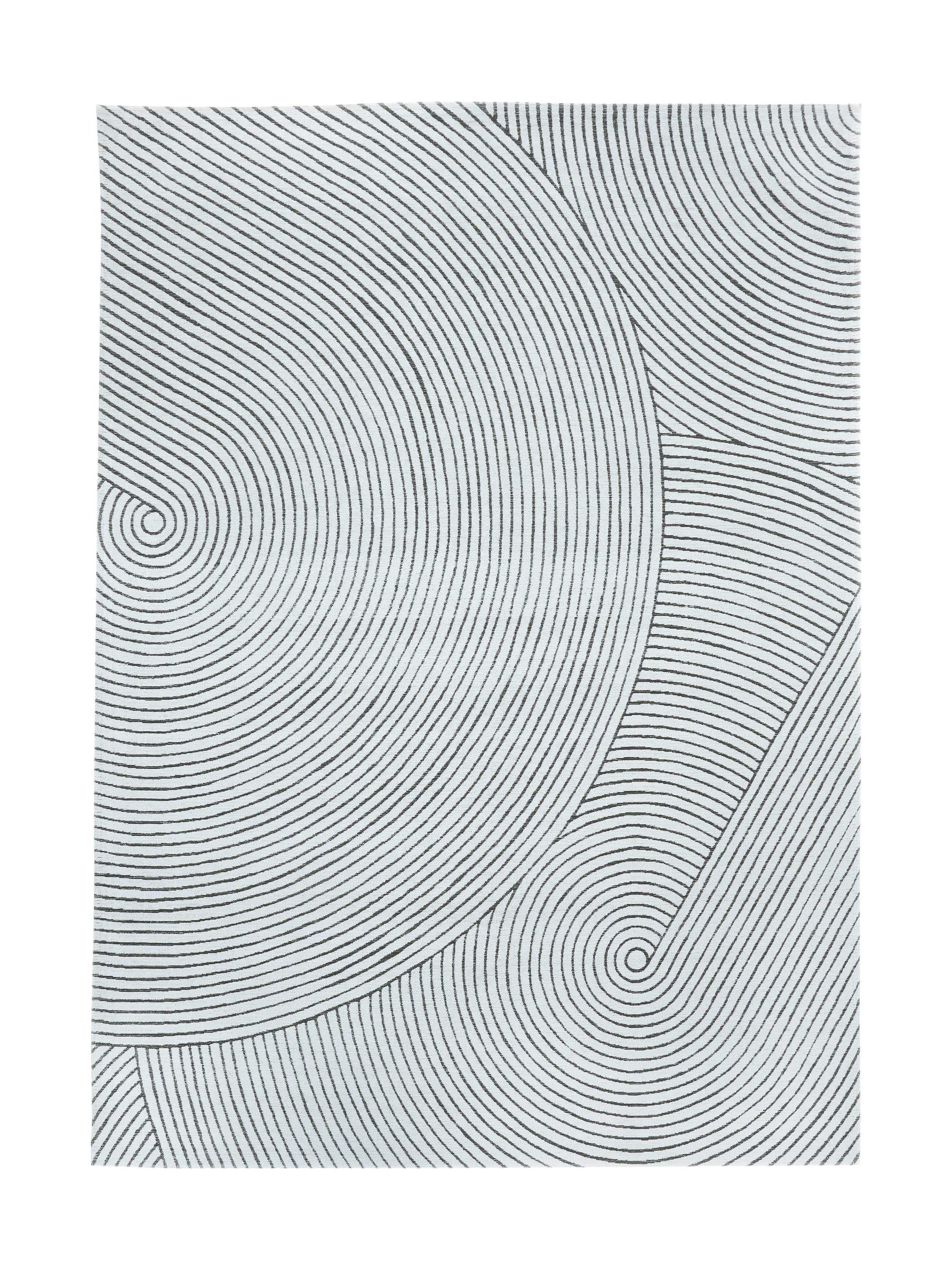 Tapis rectangulaire avec motif de cercles concentriques noirs sur fond blanc, style abstrait