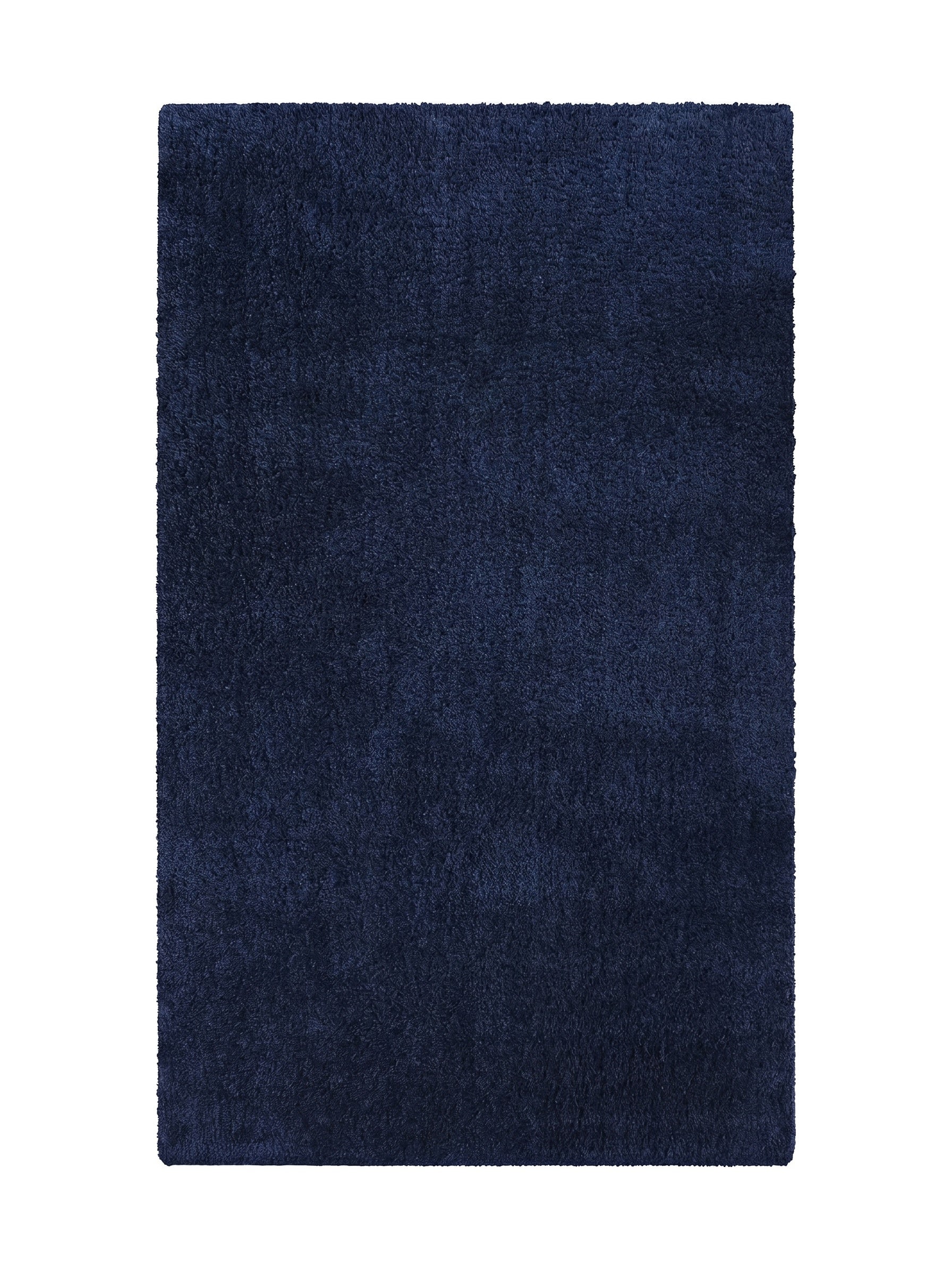 Tapis rectangulaire bleu marine à la texture shaggy et aux poils longs, semblant doux et confortable