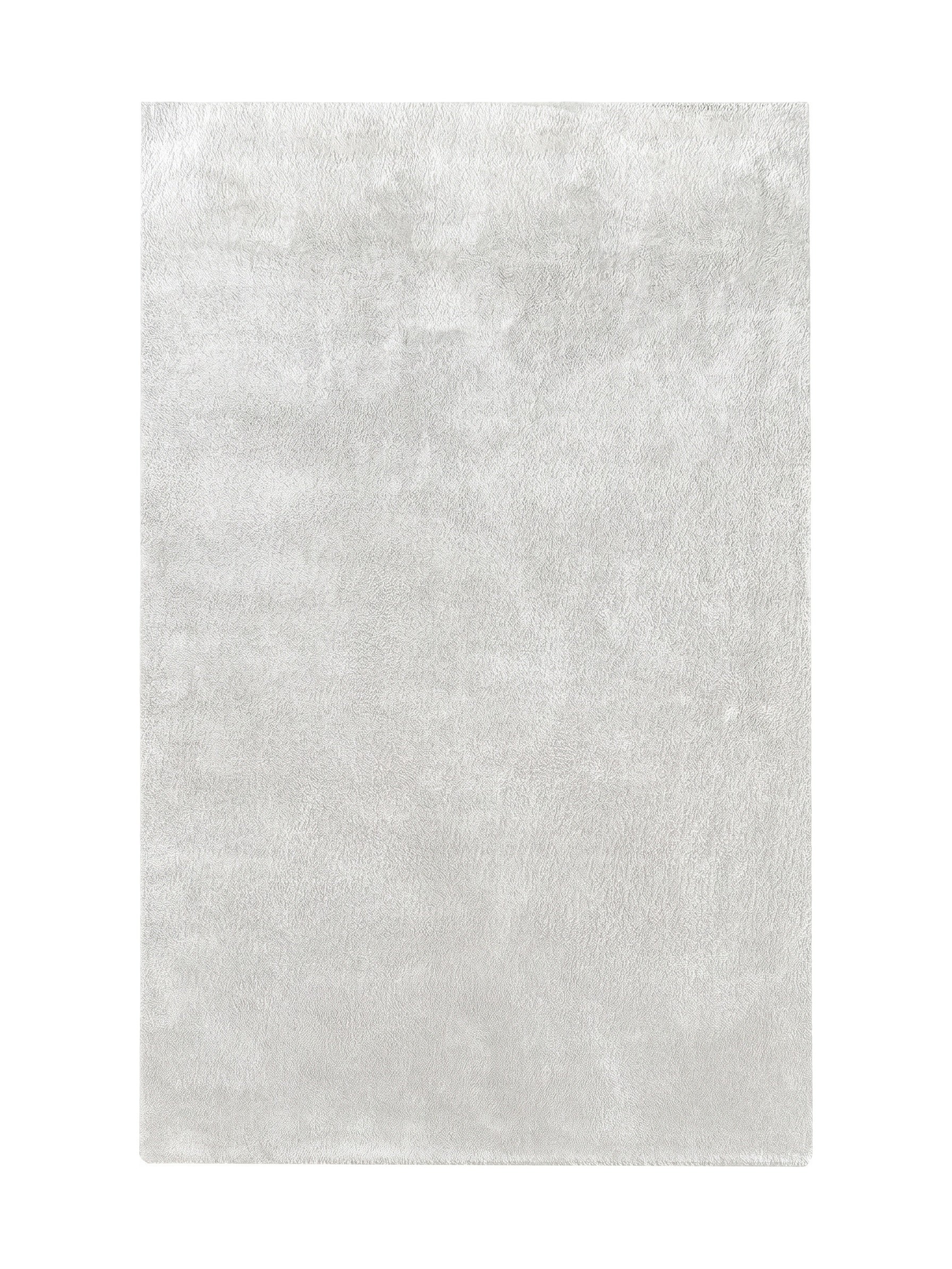 Tapis rectangulaire blanc cassé avec une texture épaisse et moelleuse, au poil long et doux