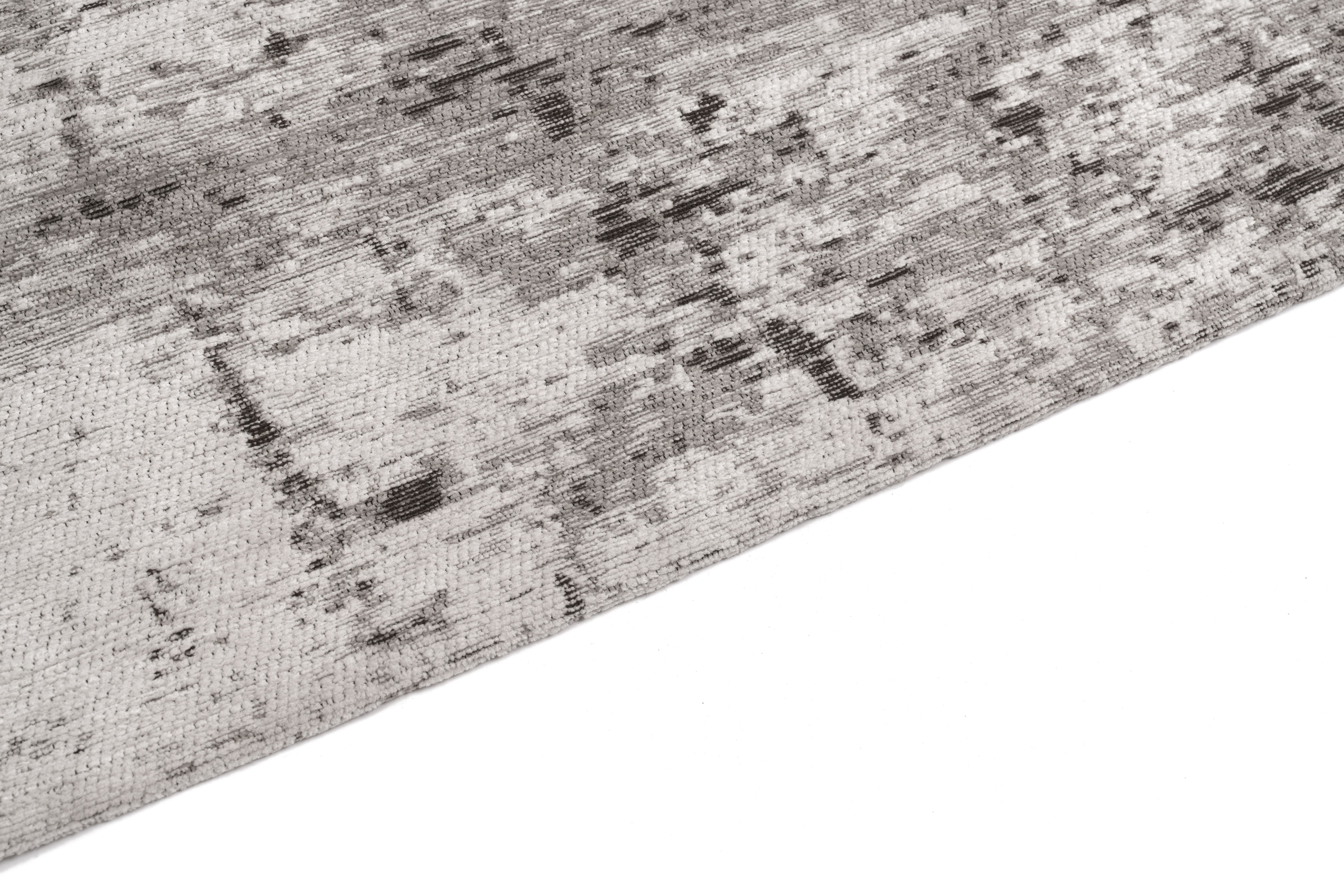 Bordure de tapis avec finition texturée. Couleurs grises et anthracite