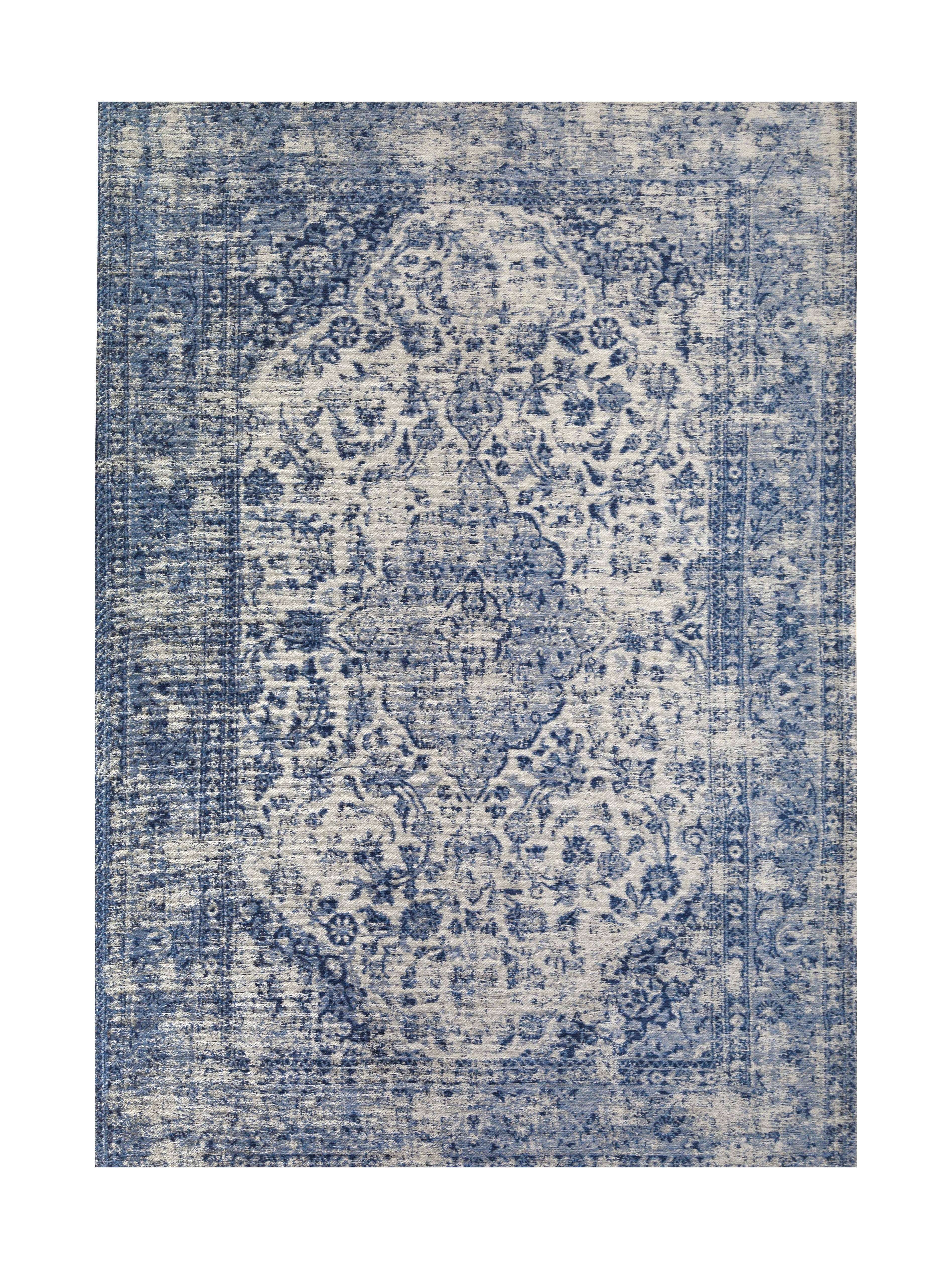 Tapis rectangulaire de style persan avec un motif floral en bleu et blanc, ambiance classique