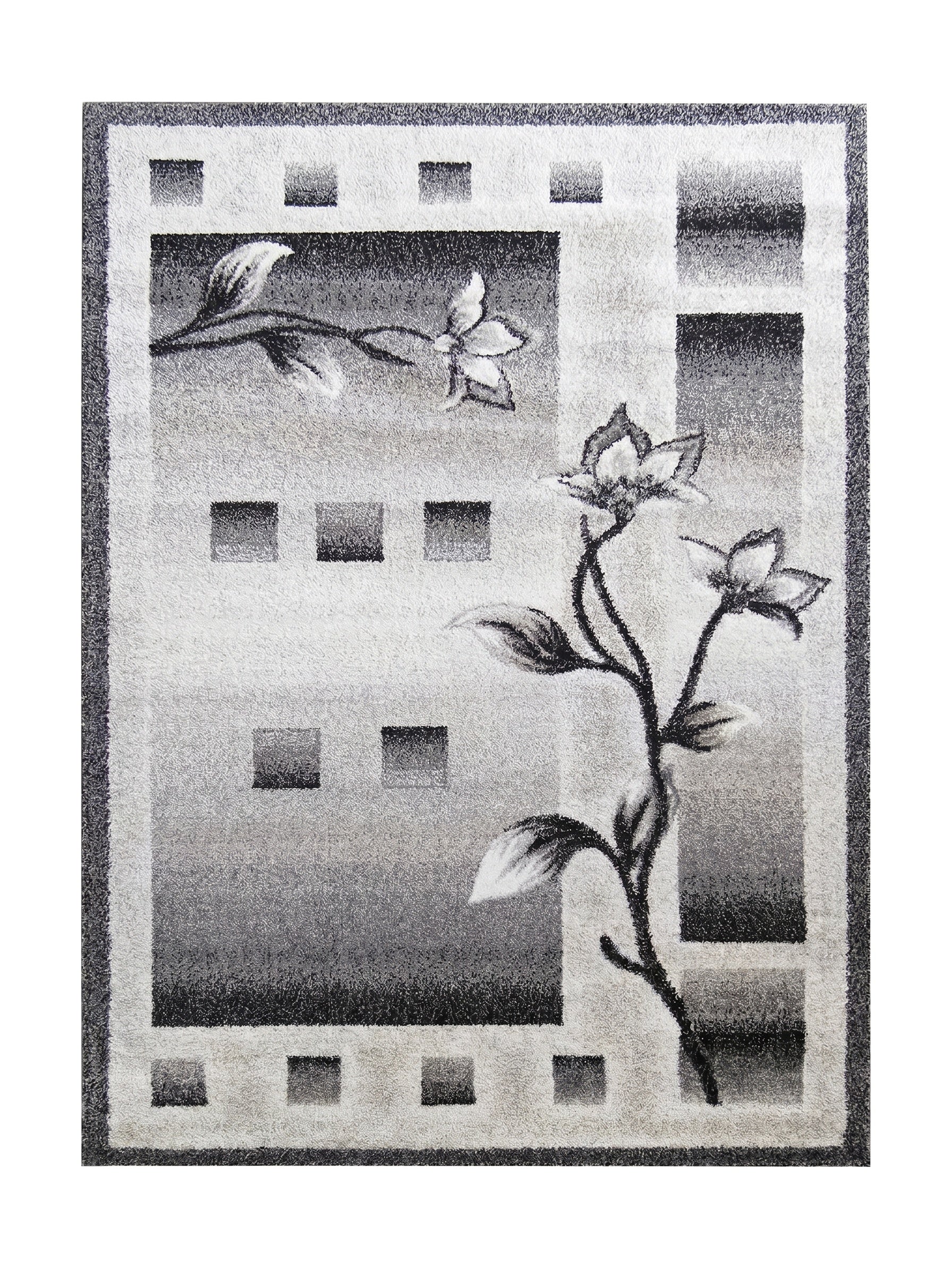 Tapis rectangulaire aux motifs floraux et géométriques dégradés de gris, du clair au foncé, avec une texture douce