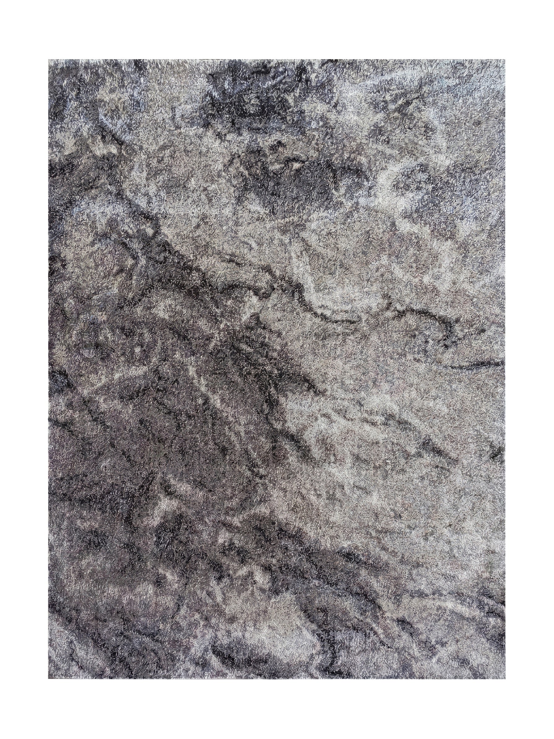 Tapis rectangulaire à poils longs, présentant un motif abstrait marbré dans des nuances de gris clair et foncé