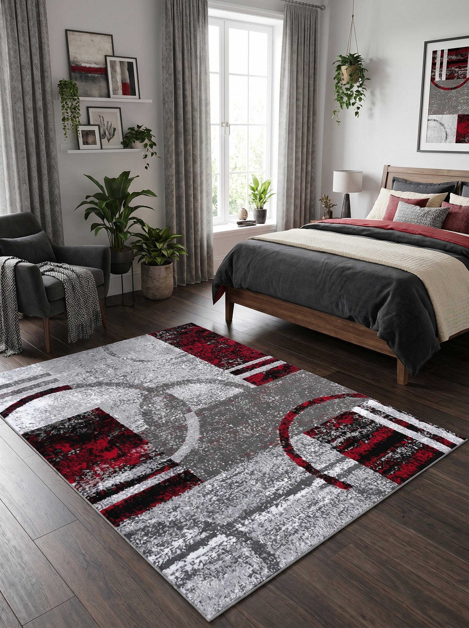 Tapis abstrait gris, rouge et noir, motifs géométriques et cercles, texturé, sur parquet en chambre