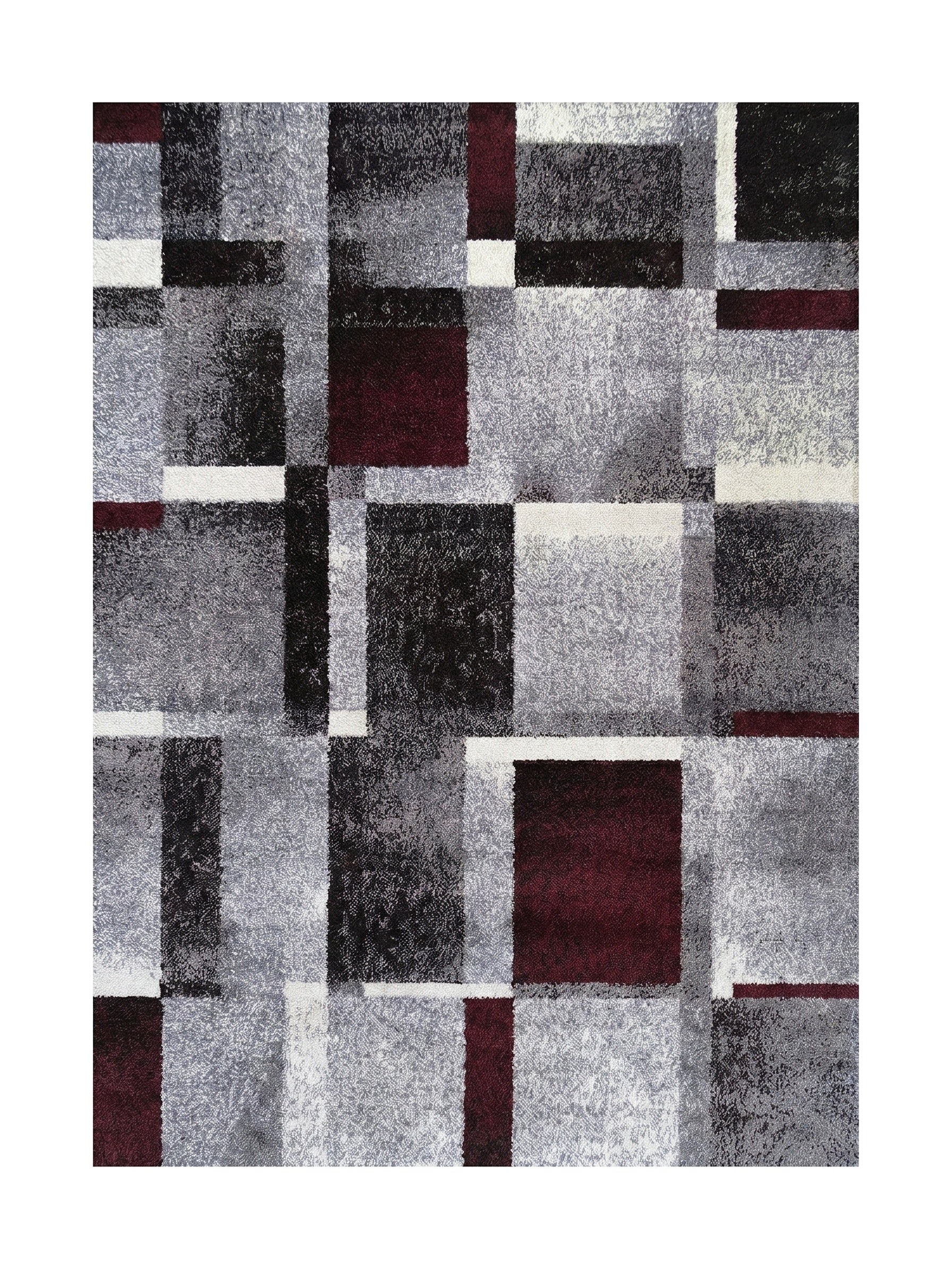 Tapis moelleux à motif géométrique de carrés et rectangles gris, noirs, blancs et bordeaux