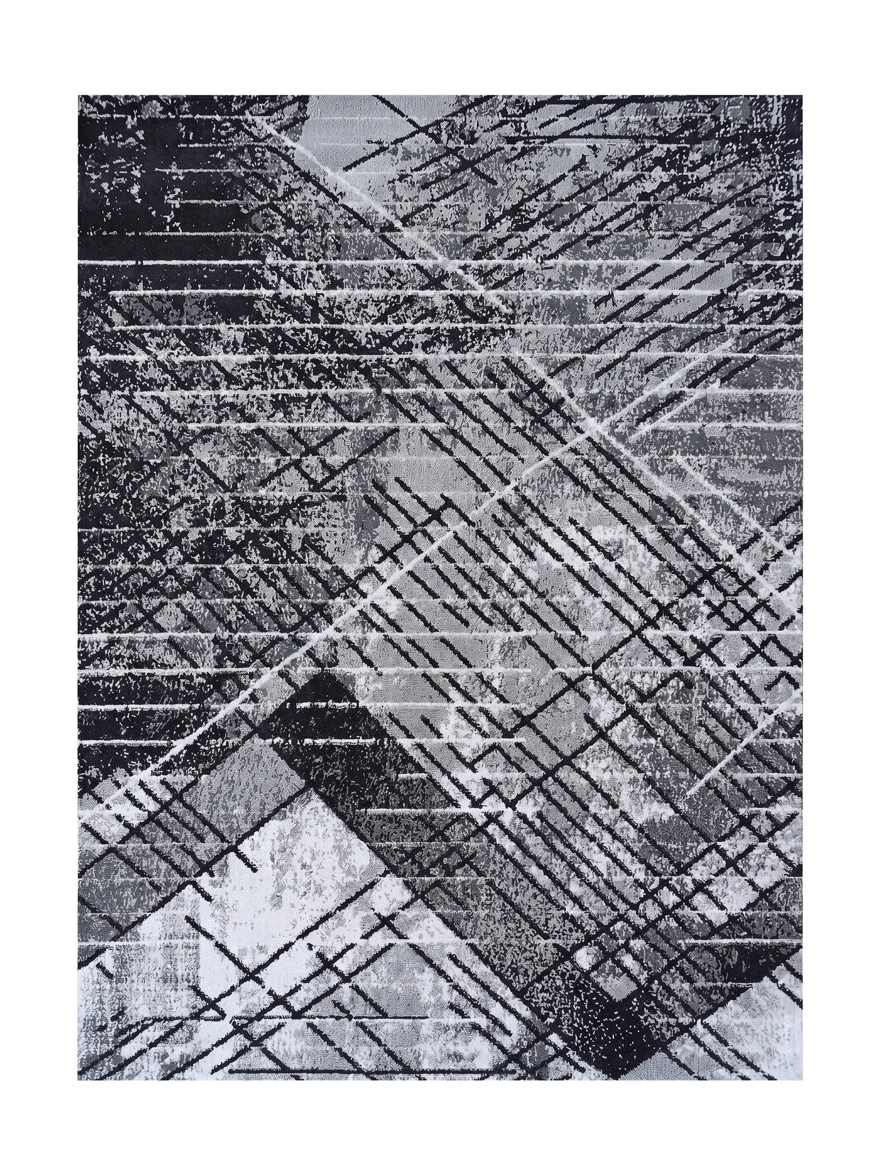 Tapis aux motifs abstraits géométriques noirs, gris et blancs, avec des lignes entrecroisées et des zones texturées