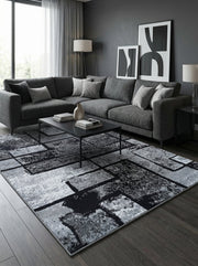 Tapis rectangulaire à motifs géométriques abstraits gris, noirs et blancs avec un effet texturé, dans un salon contemporain