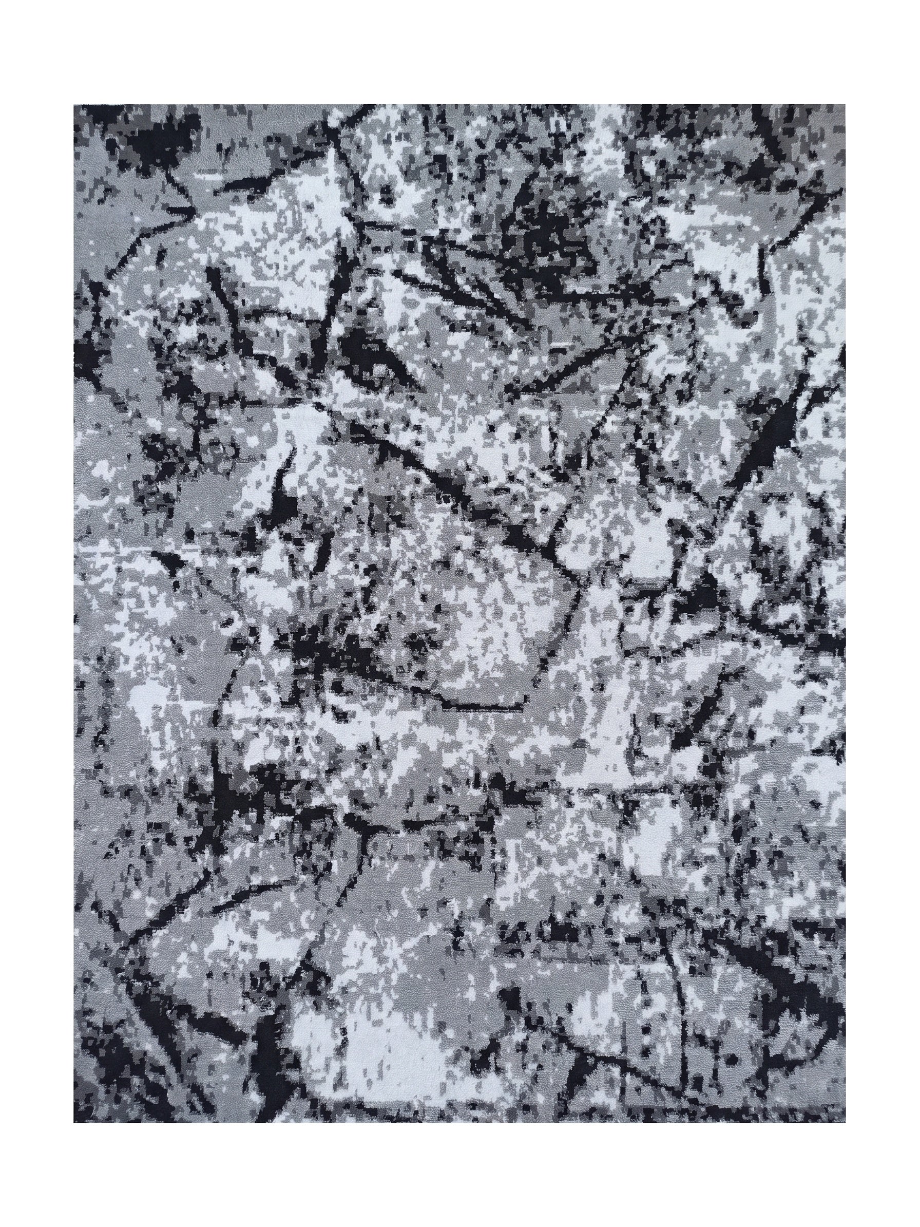 Tapis aux motifs abstraits gris, noirs et blancs, évoquant des craquelures ou un effet marbré