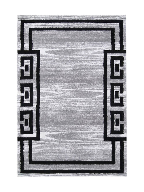 Grand tapis rectangulaire avec un fond gris texturé et une bordure noire à motifs géométriques emboîtés