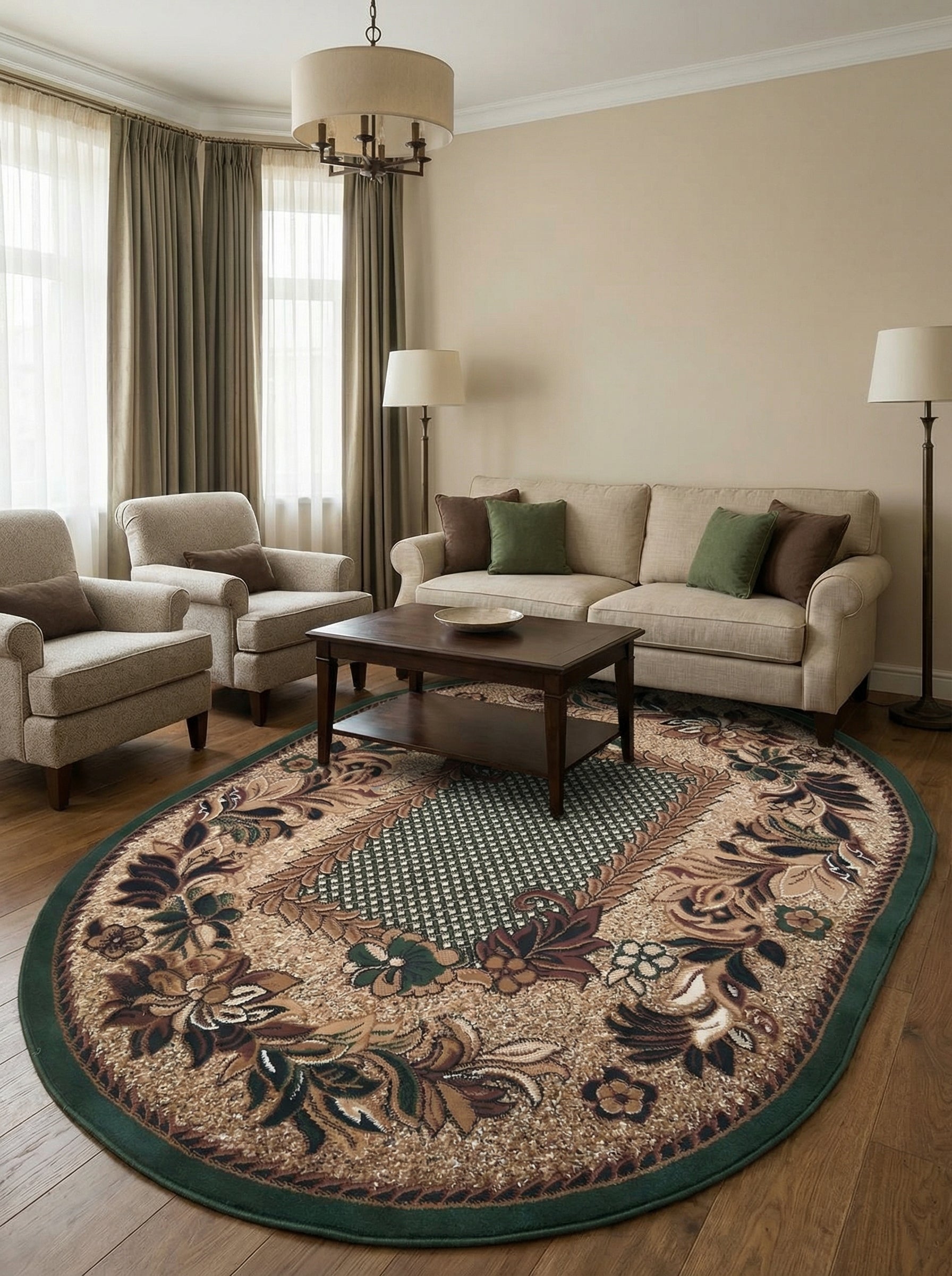 Tapis ovale beige à bord vert foncé, orné de motifs floraux bruns et verts luxuriants entourant un panneau central géométrique, dans un salon