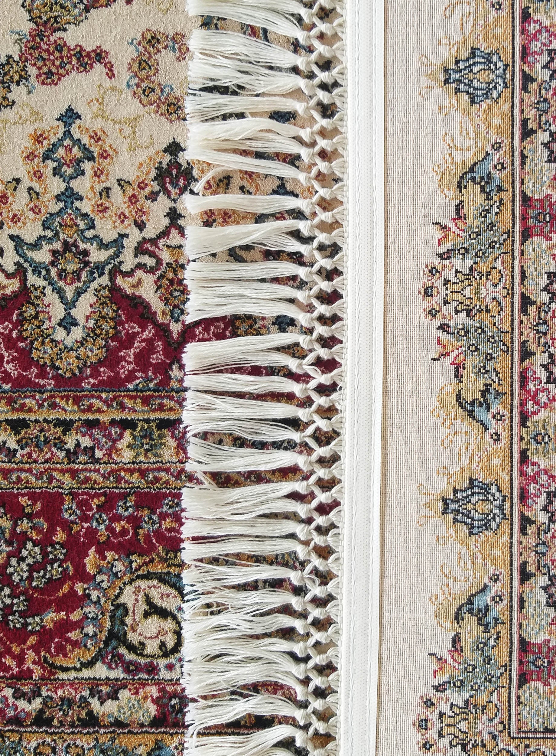 Tapis tissé à motifs floraux et arabesques traditionnels rouges, crème, or et bleus avec franges